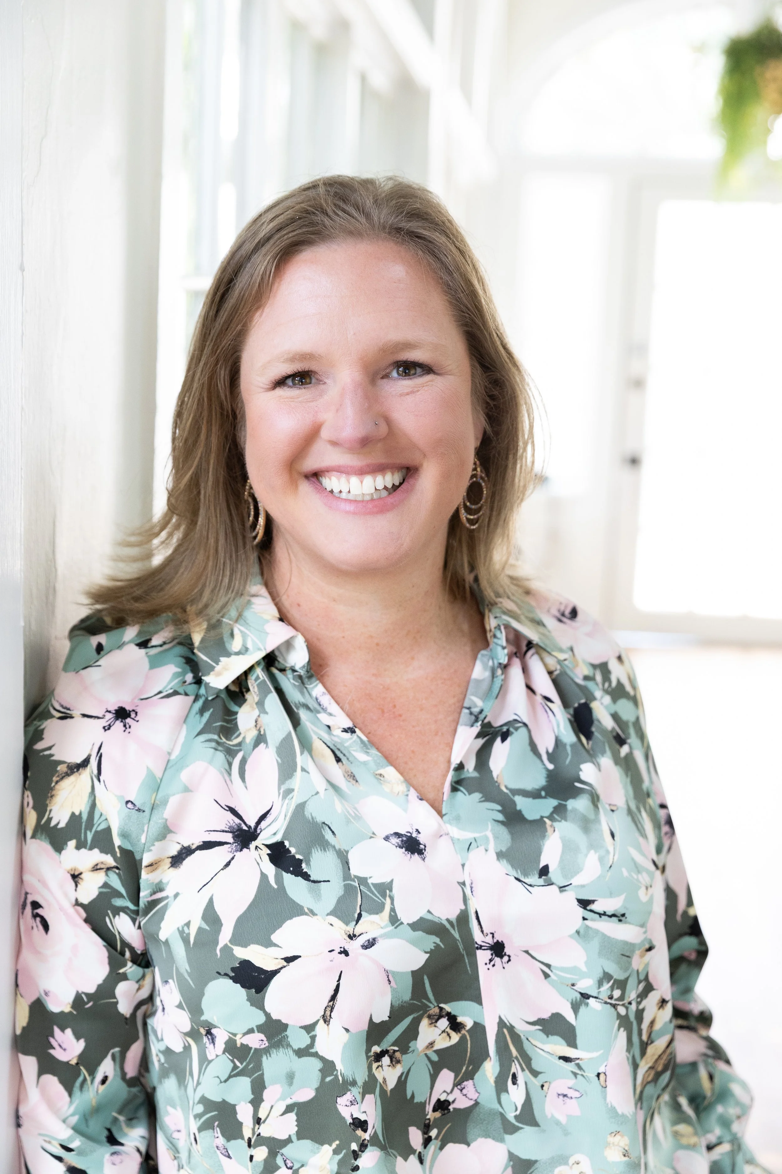 Kayla Furman professional headshot, St. Augustine Florida family photographer offering studio and outdoor portraits for families, children, and seniors in St. Johns County and Jacksonville
