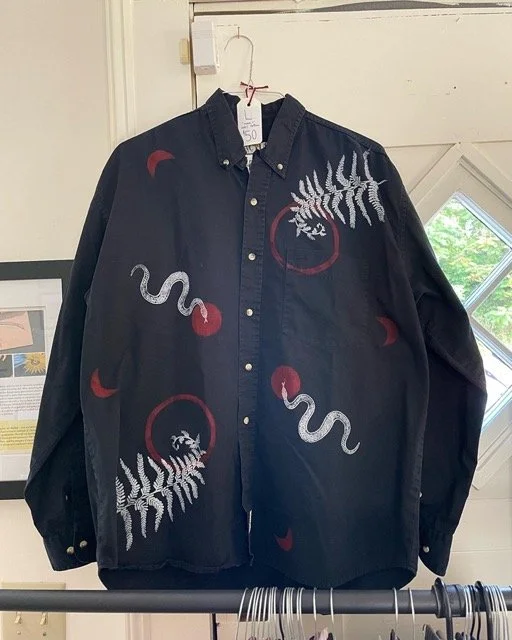 black button up shirt with white ferns and snakes