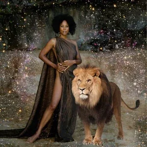 A woman wearing a flowing dress standing next to a lion with a starry galaxy background