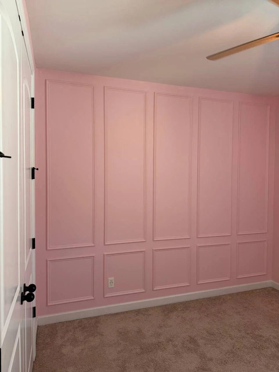 Pink molding accent wall in a nursery, Matthews NC