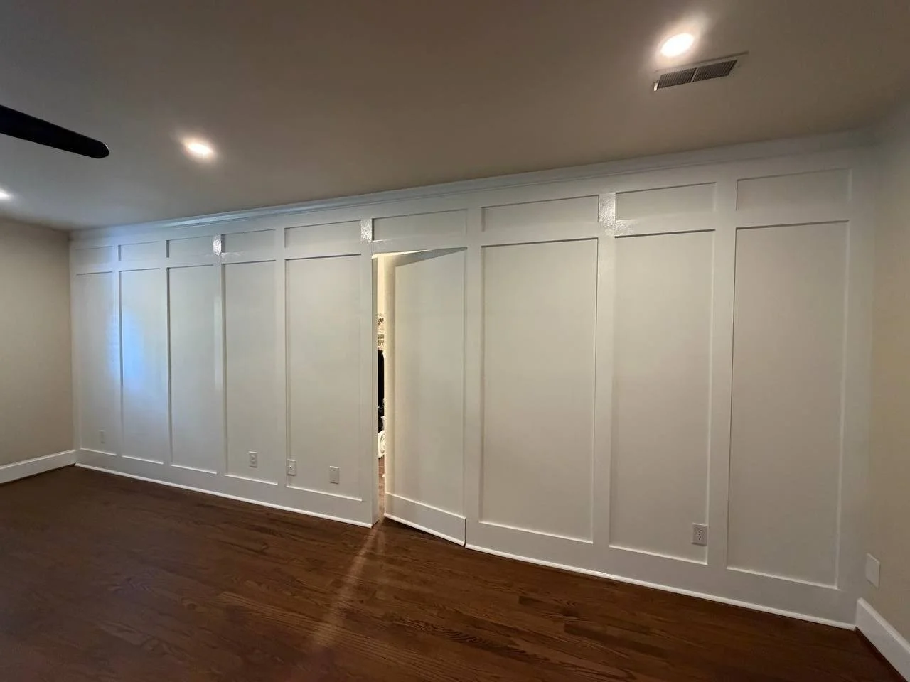 Bedroom molding accent wall with the closet door built into the design, Charlotte NC