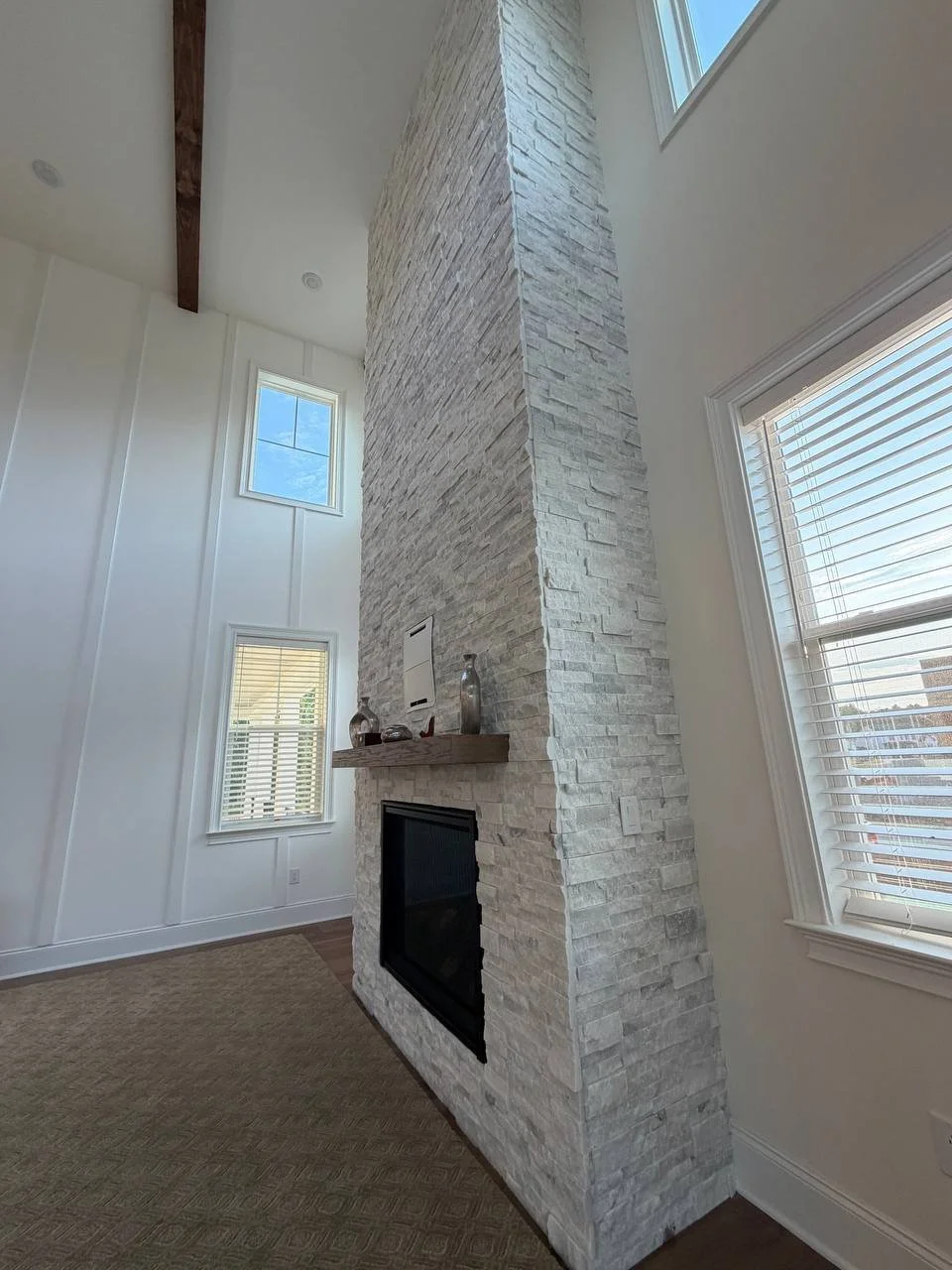 Side profile of the stone fireplace column showing full-height marble returns, Raleigh NC