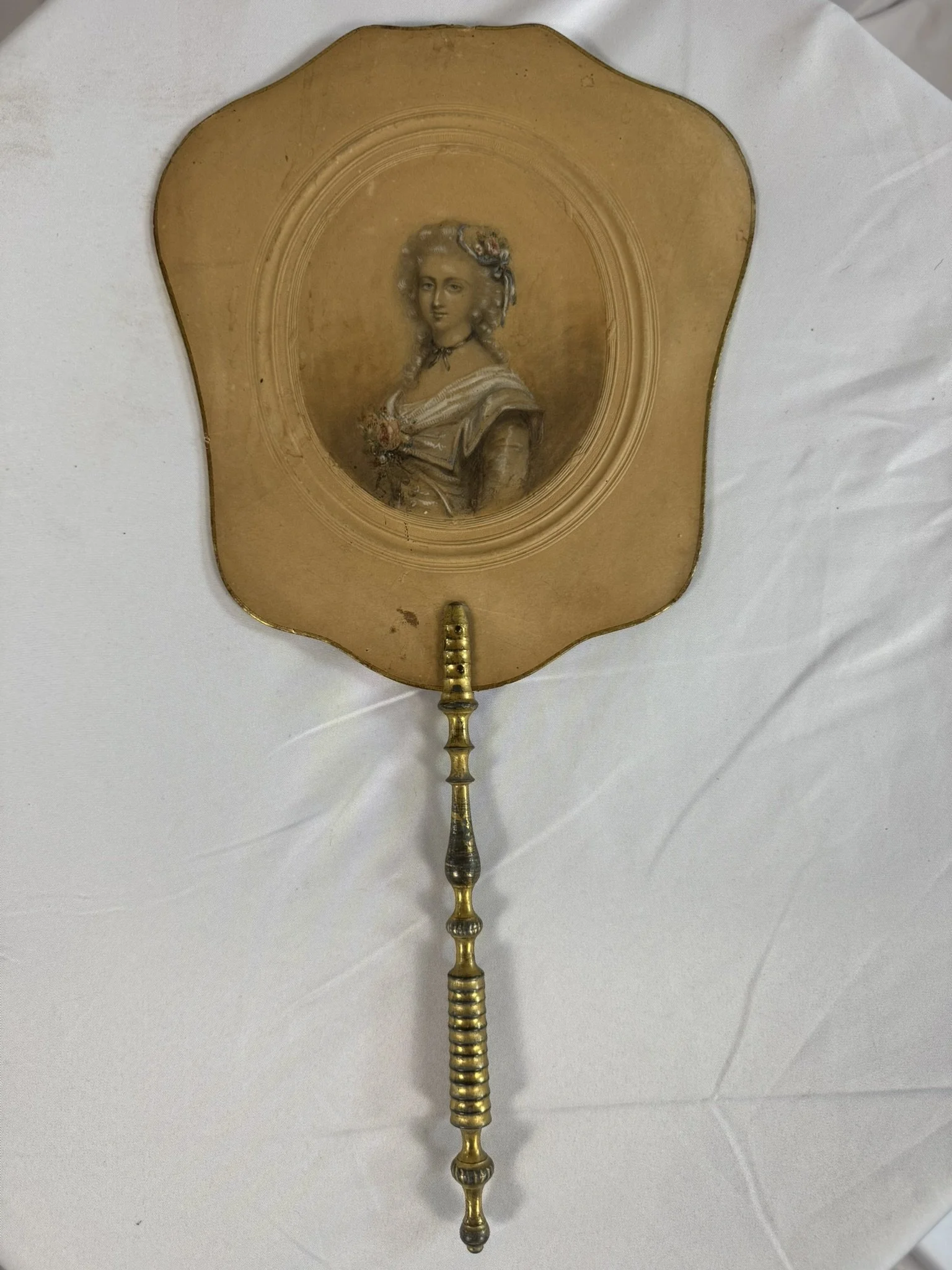 Antique French hand fire screen, ecran a main, Restoration period c.1820, front face, embossed card leaf, hand-coloured lithograph court portrait, gilt wood handle, full view
