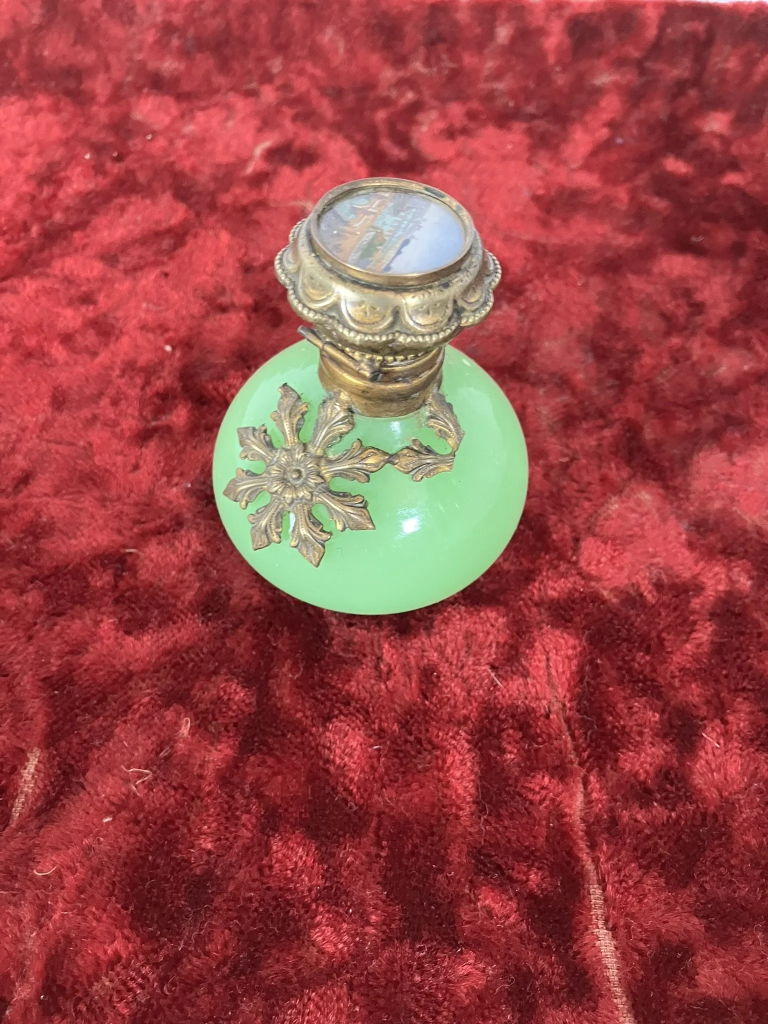 Green uranium opaline scent bottle with gilt metal mounts, hinged lid closed