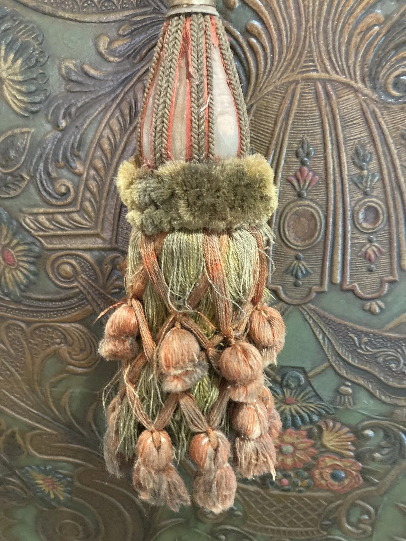 French chateau passementerie tassel tieback in olive and terracotta with velvet ruff and drop tassel skirt