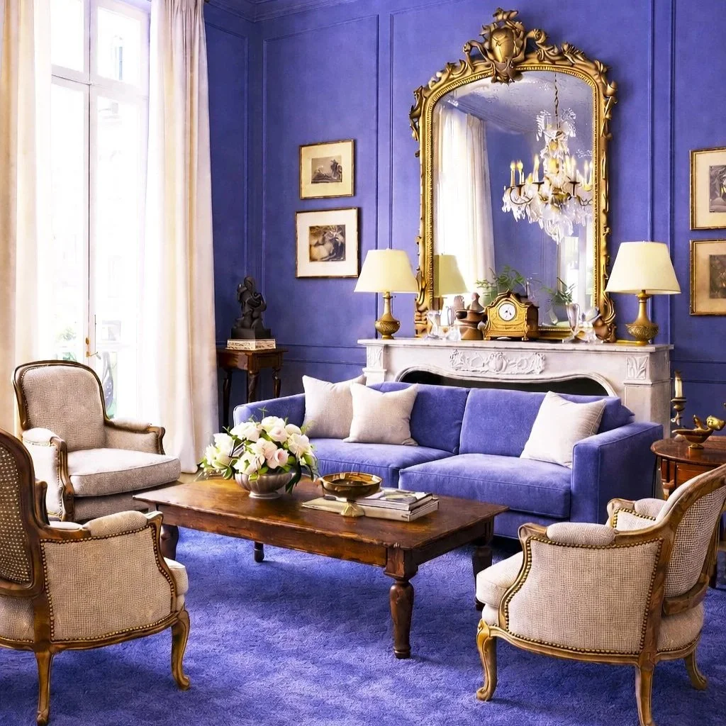 Sumptuous salon with jewel-toned walls, antique velvet upholstery, Louis XVI bergères, ornate giltwood mirror, crystal chandelier, and curated gallery wall of Old Master paintings