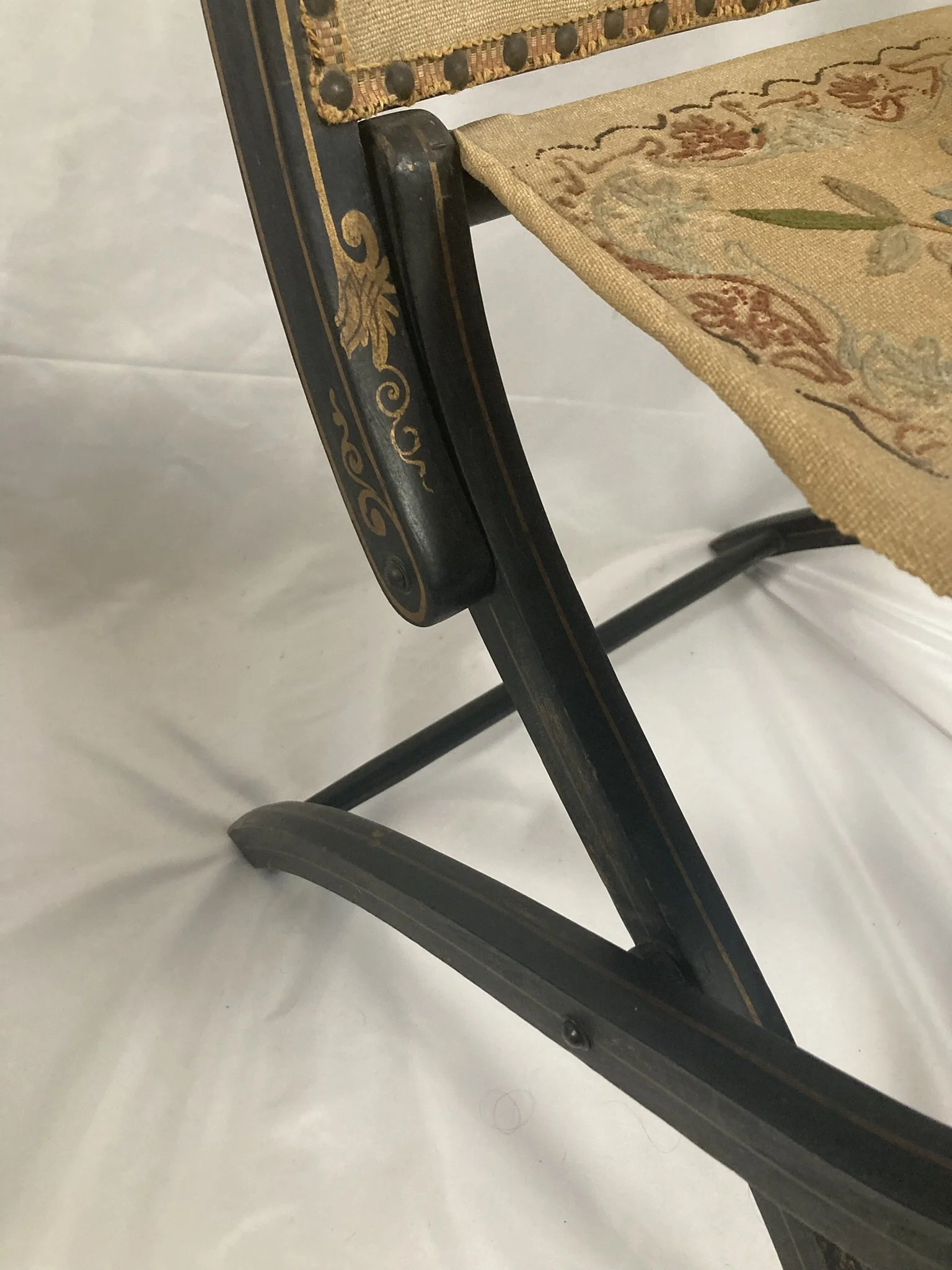 napoleon-iii-chair-back-panel-overhead.jpg — "Overhead view of Napoleon III folding armchair back panel with original embroidered upholstery and brass nail head trim"