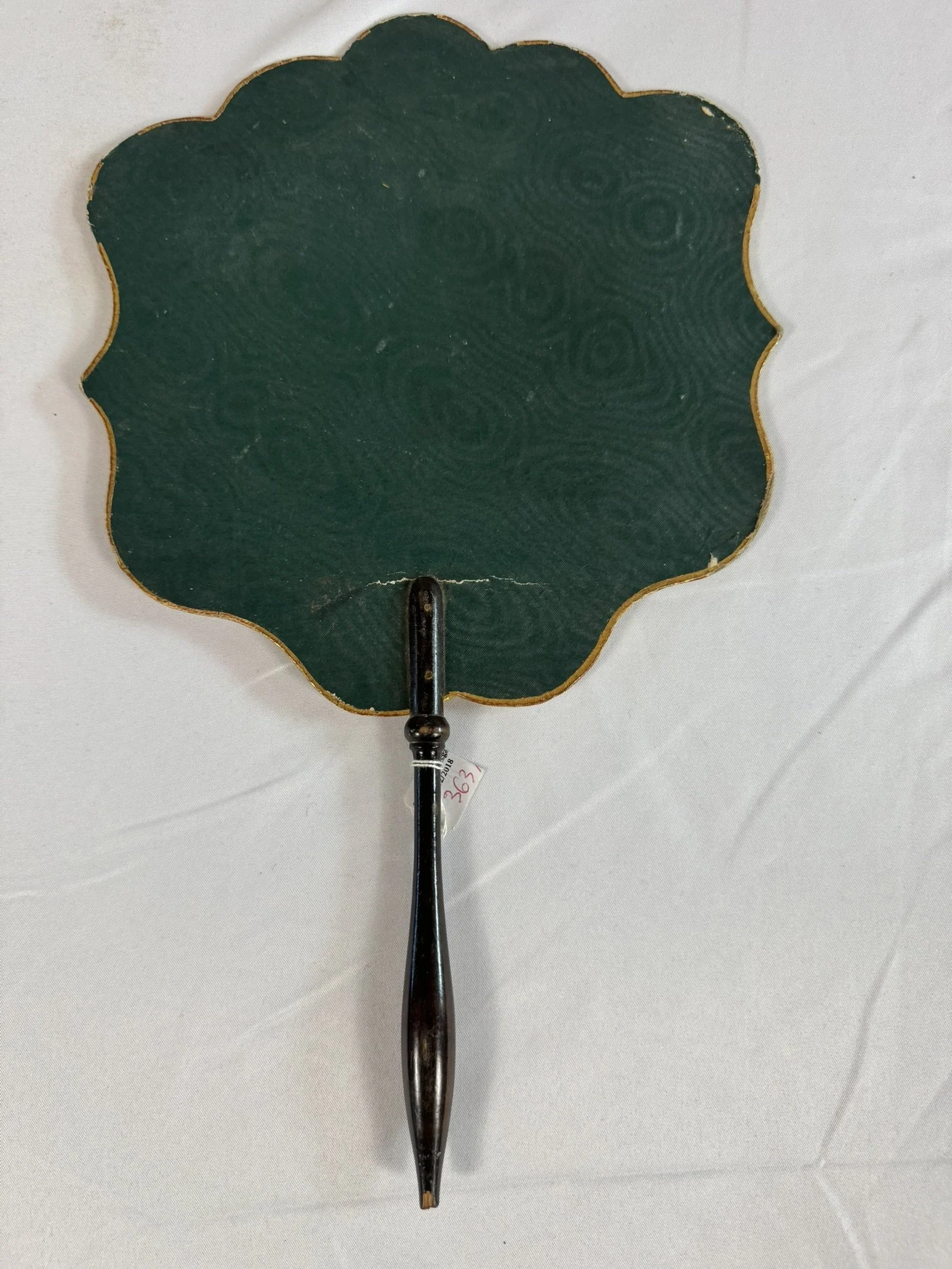 Antique French hand fire screen, ecran a main, Romantic period c.1840, reverse face, bottle-green embossed moire paper ground, gilt outer edge, ebonised handle