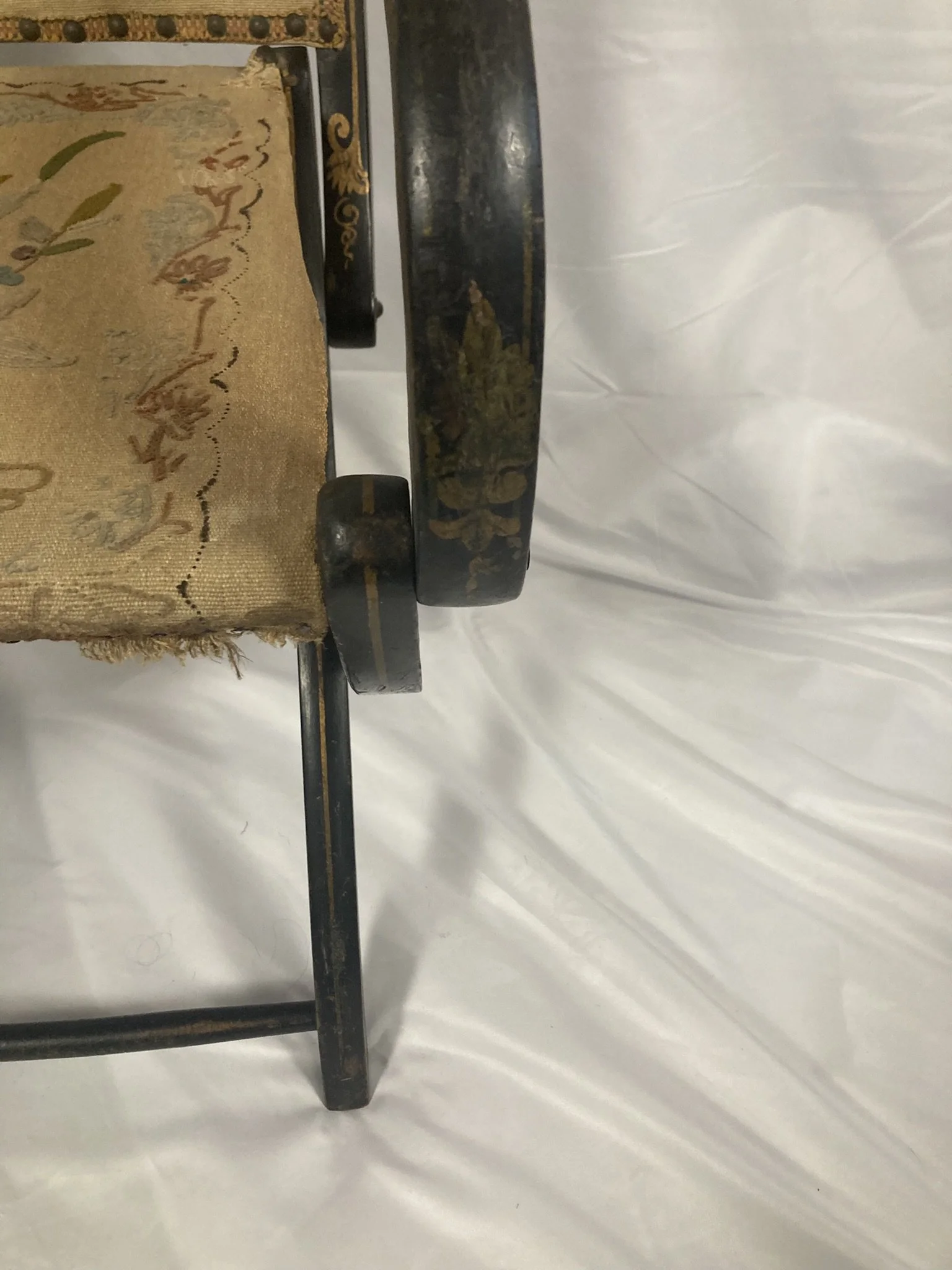 napoleon-iii-chair-back-panel-overhead.jpg — "Overhead view of Napoleon III folding armchair back panel with original embroidered upholstery and brass nail head trim"