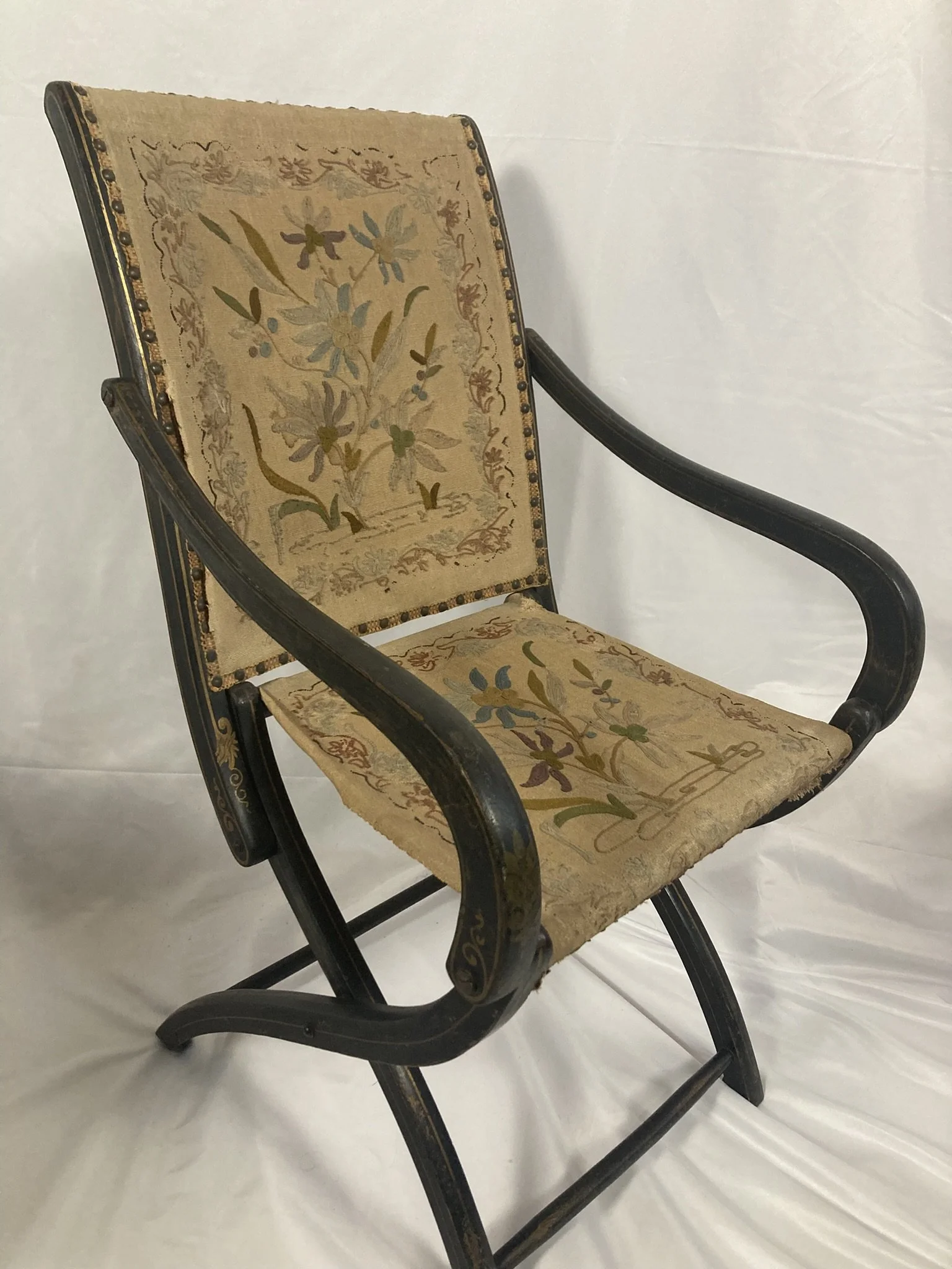 napoleon-iii-folding-armchair-three-quarter.jpg — "Napoleon III French folding armchair, three-quarter view showing ebonized frame and scrolled arms"
