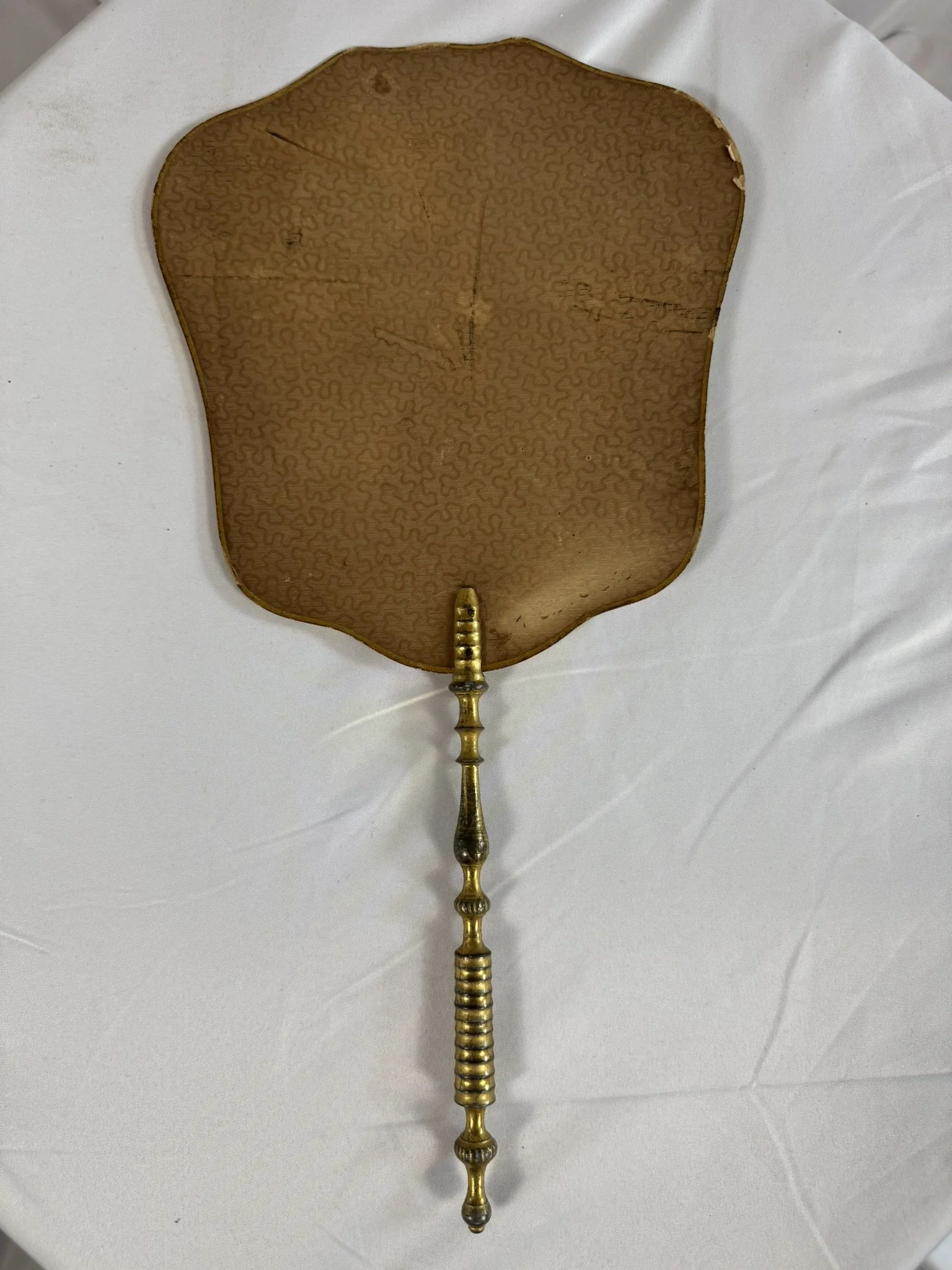 Antique French hand fire screen, ecran a main, Restoration period c.1820, reverse face, brown embossed vermicular paper ground, gilt outer edge, gilt wood handle