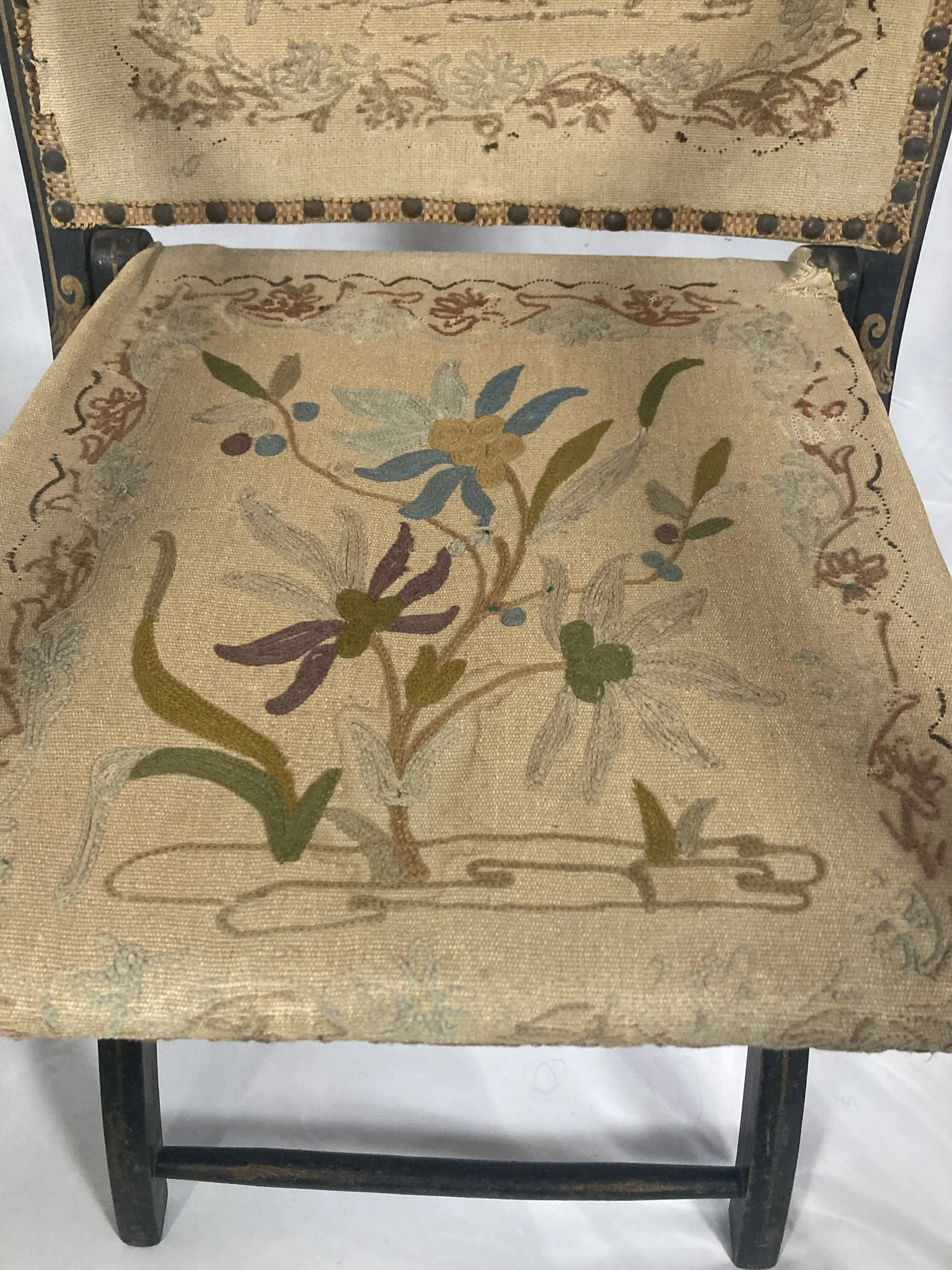 napoleon-iii-chair-seat-detail-crewelwork.jpg — "Close-up of original crewelwork needlework seat upholstery, Napoleon III armchair, floral wool embroidery on linen