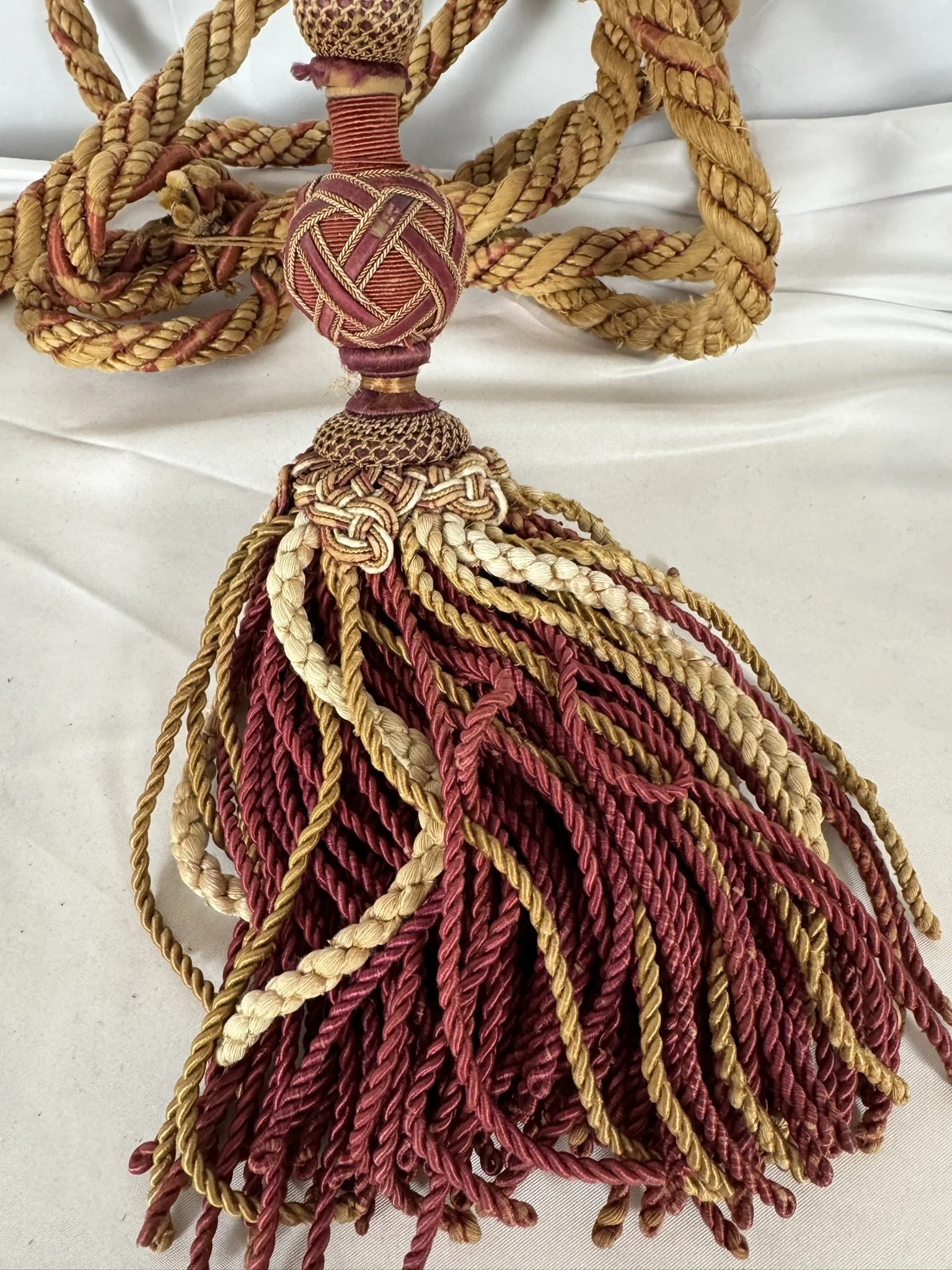 Château passementerie tassel in madder red, gold and cream silk with a deep bullion skirt
