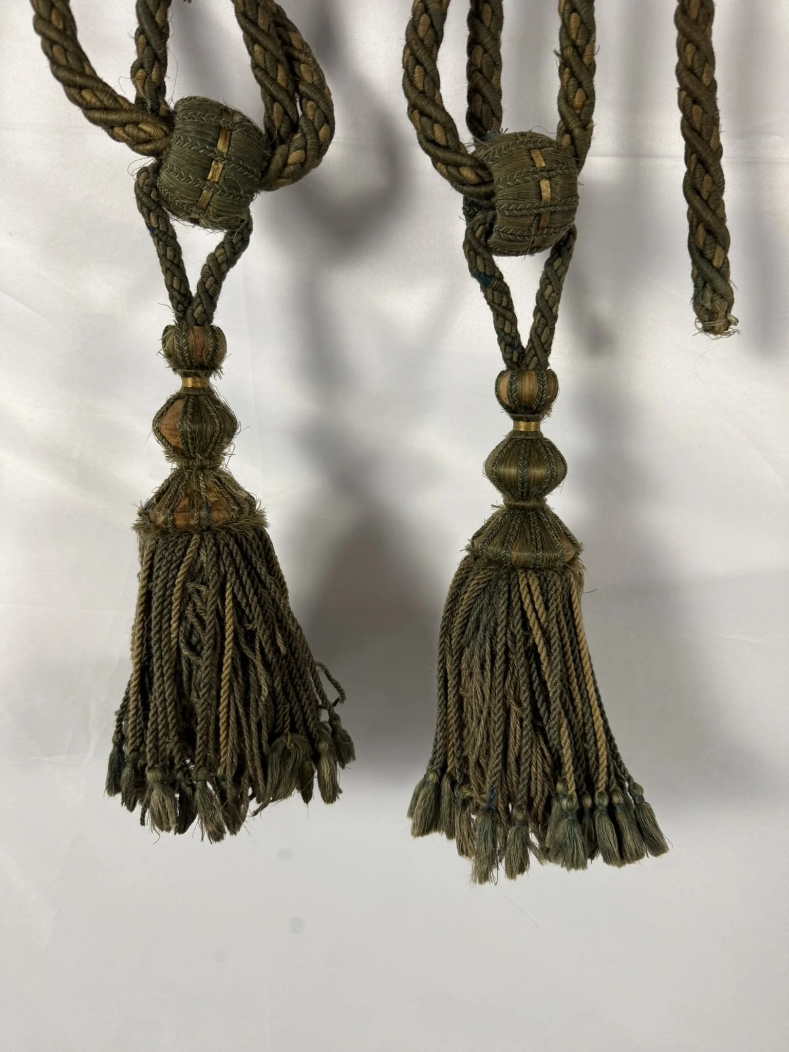 Pair of antique French sage green and gold silk passementerie tassel tiebacks, château find, 19th century