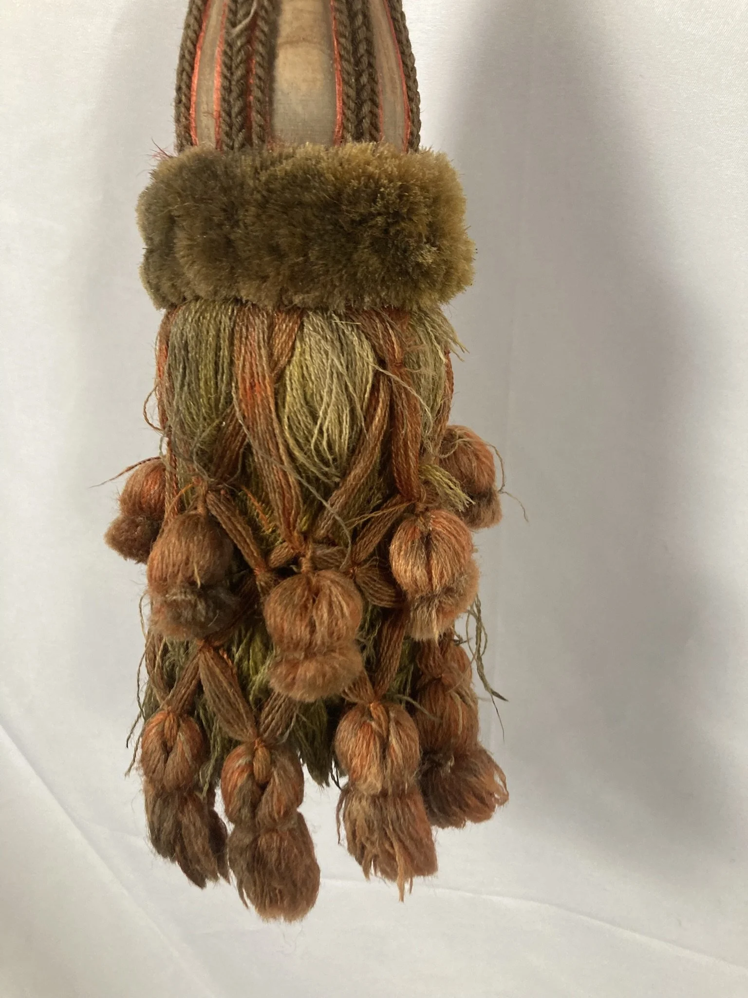 French chateau passementerie tassel tieback in olive and terracotta with velvet ruff and drop tassel skirt