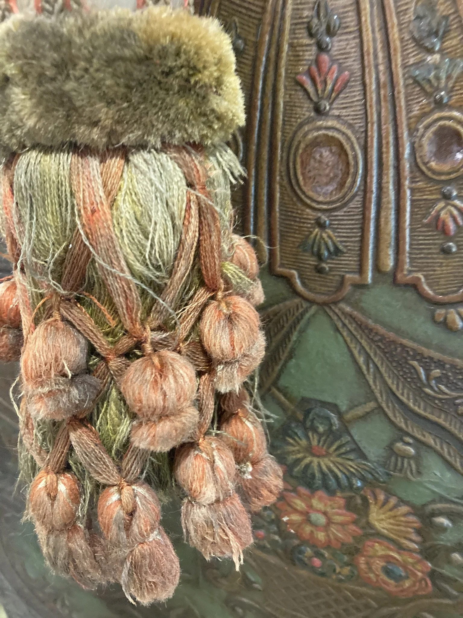French chateau passementerie tassel tieback in olive and terracotta with velvet ruff and drop tassel skirt