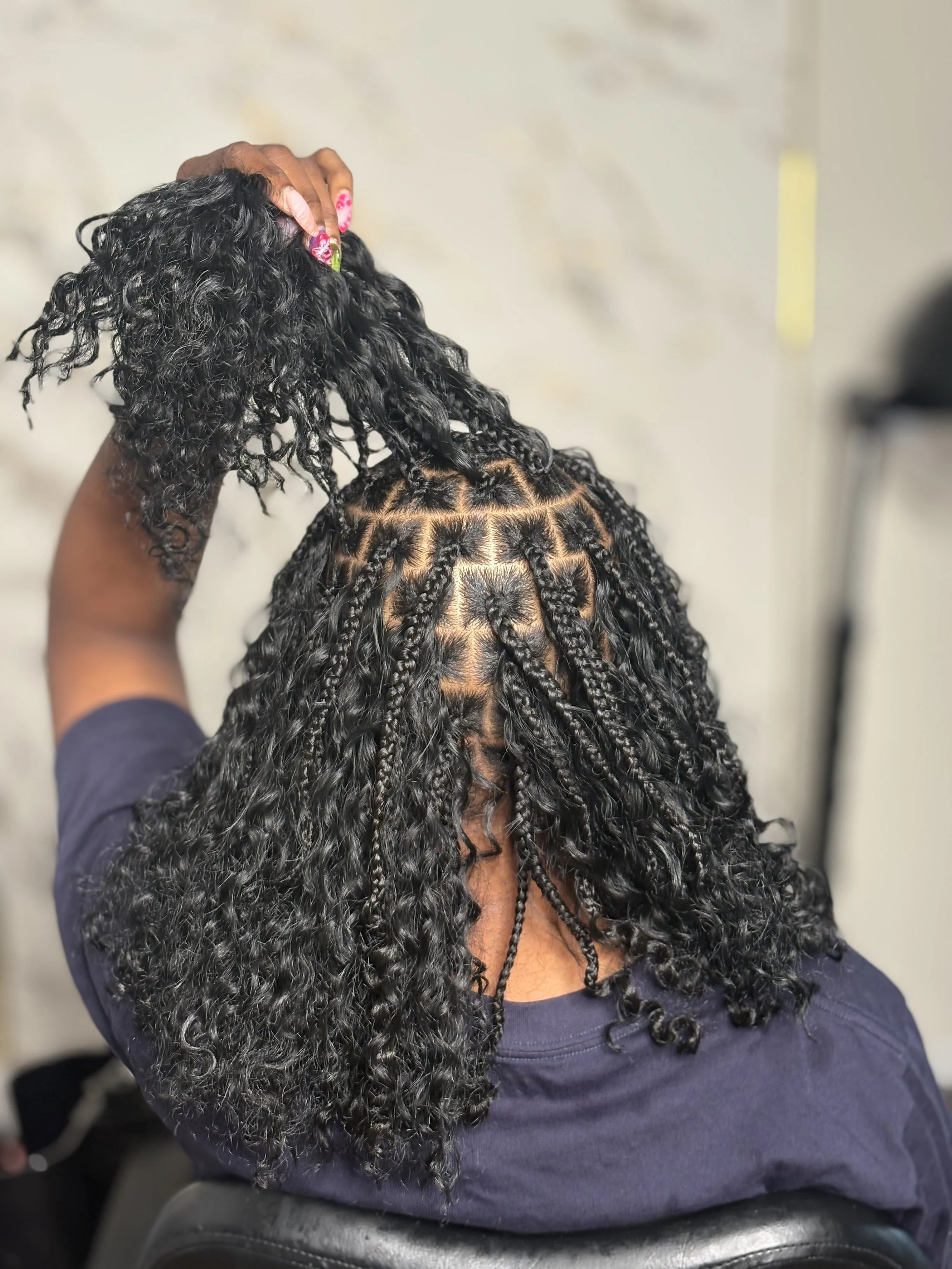 Close-up of a person with medium-sized boho braids