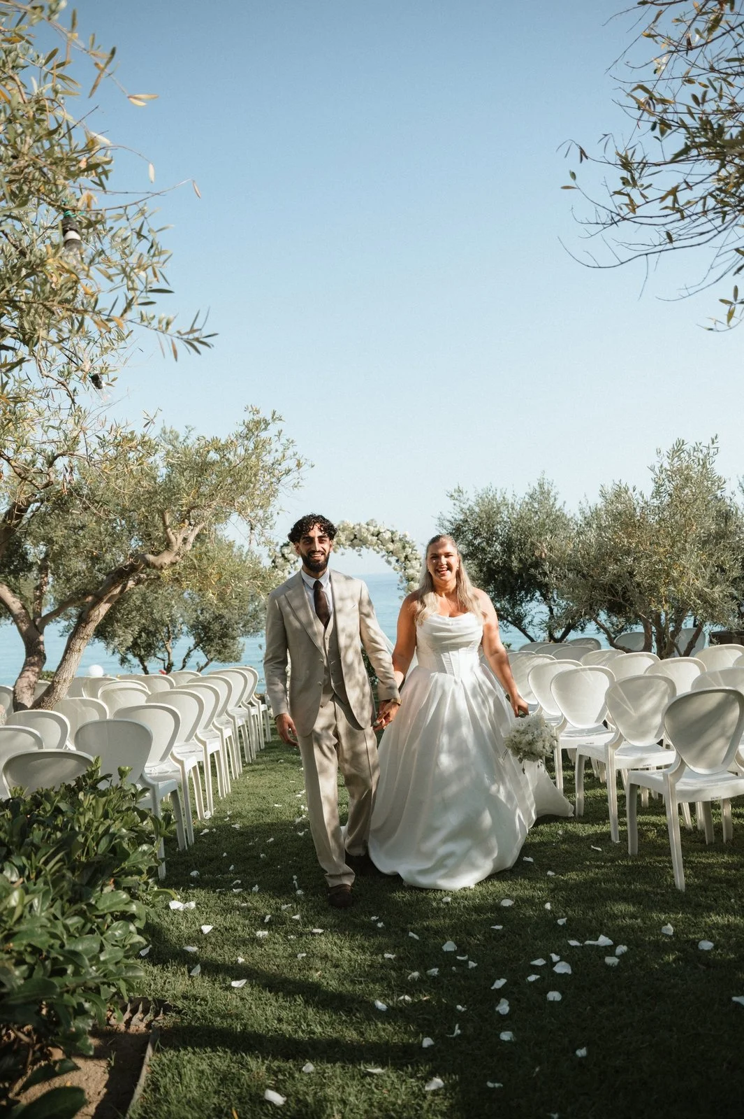 Bride and groom celebrating their wedding on a Halkidiki beach in Greece
