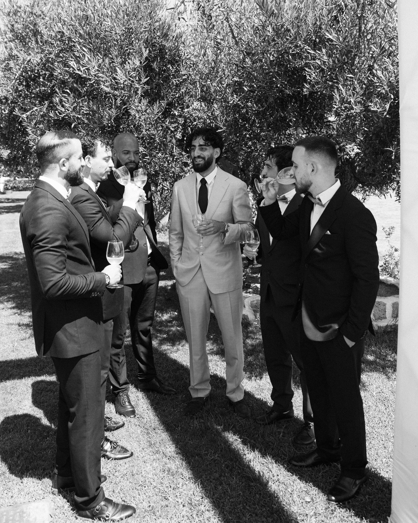 The stillness of the place, the way the light filtered through the trees, and him&mdash;standing there like he belonged in a film set, not a wedding morning. Everything felt quiet, grounded, timeless.
.
.
photographer @aggelikitsagkaraki_photography 