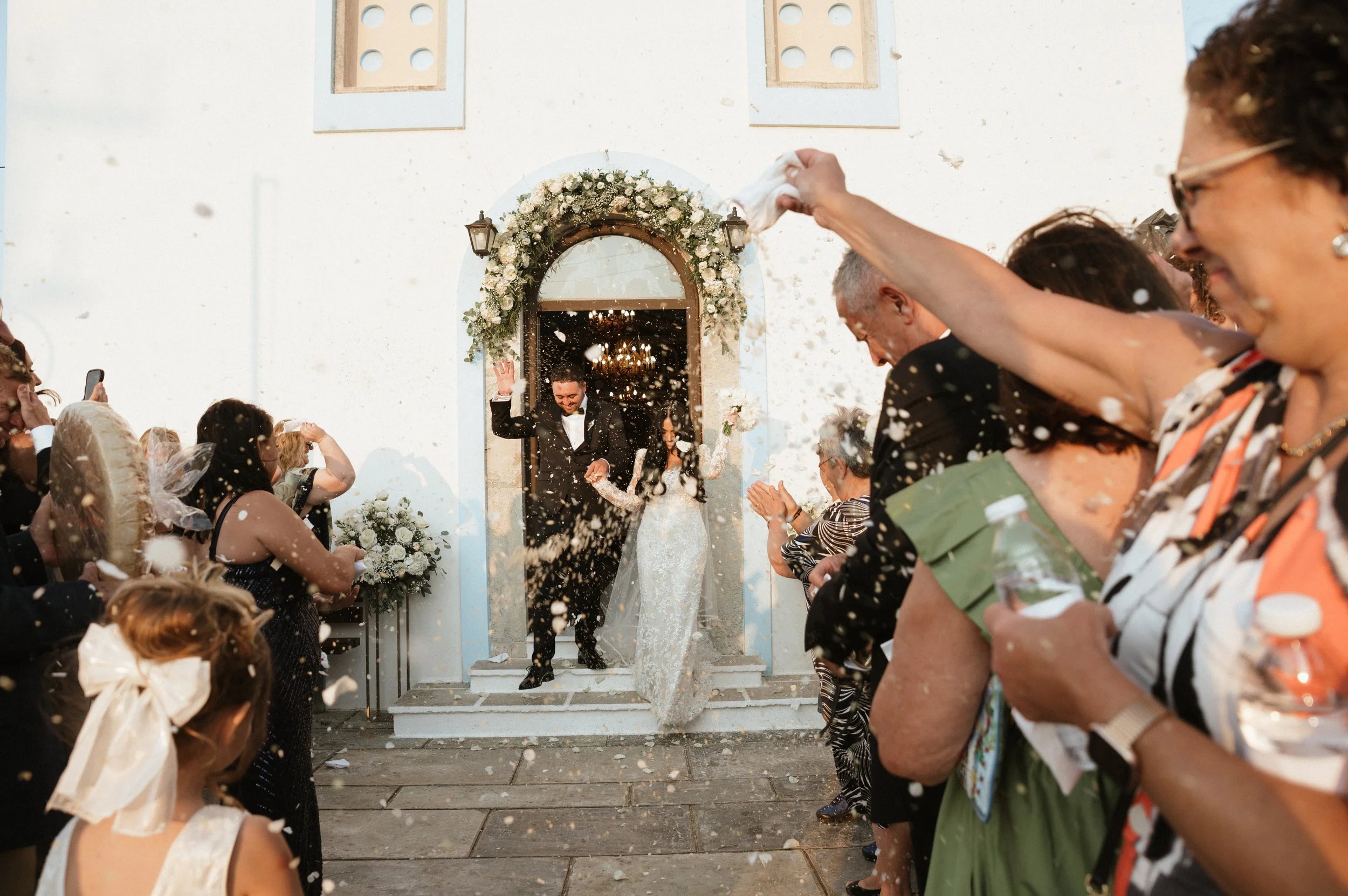 Wedding couple exiting a church on Kea Island, Greece – destination wedding photography