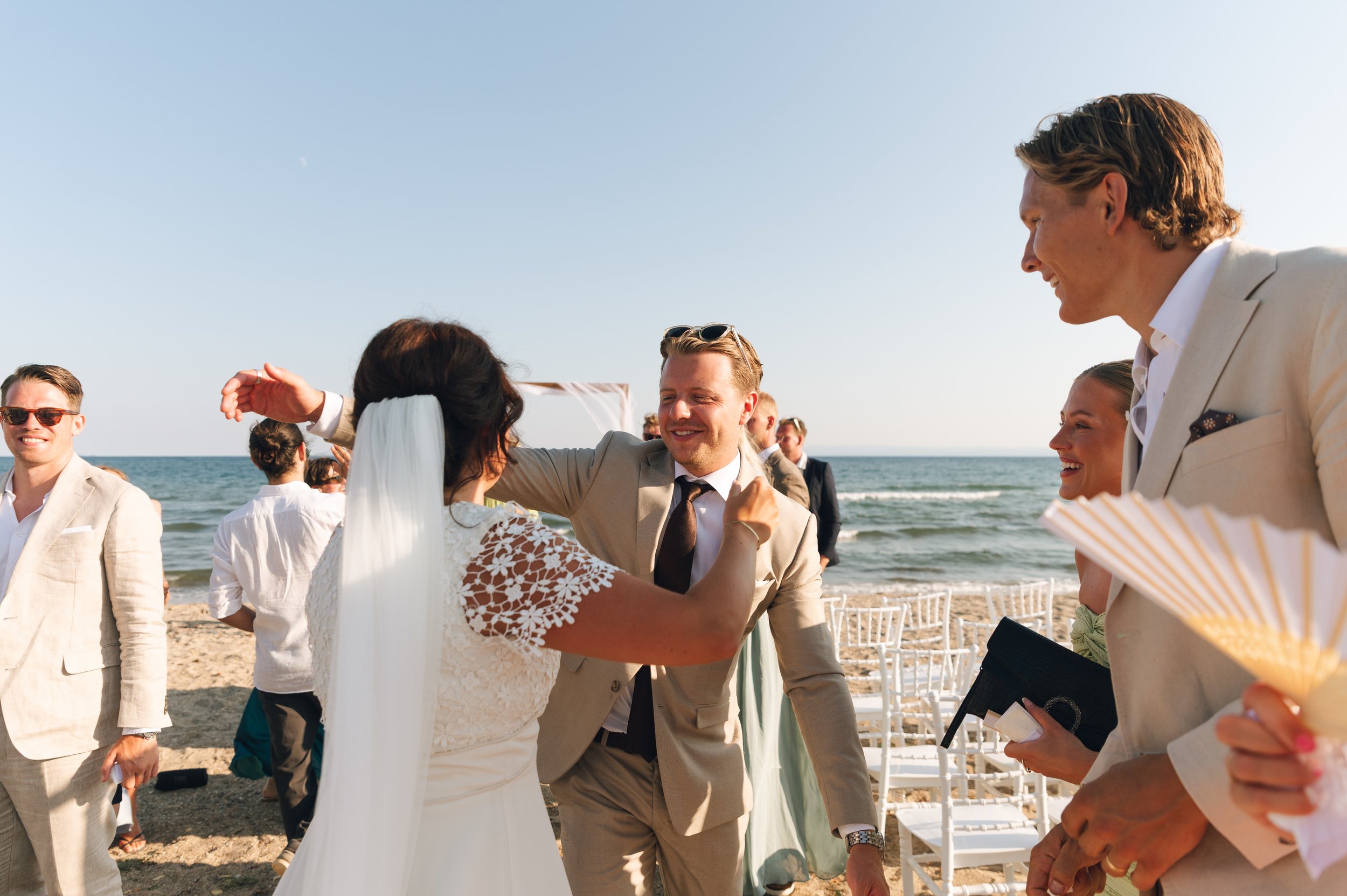 Unscripted moment between newlyweds during a destination wedding in Greece