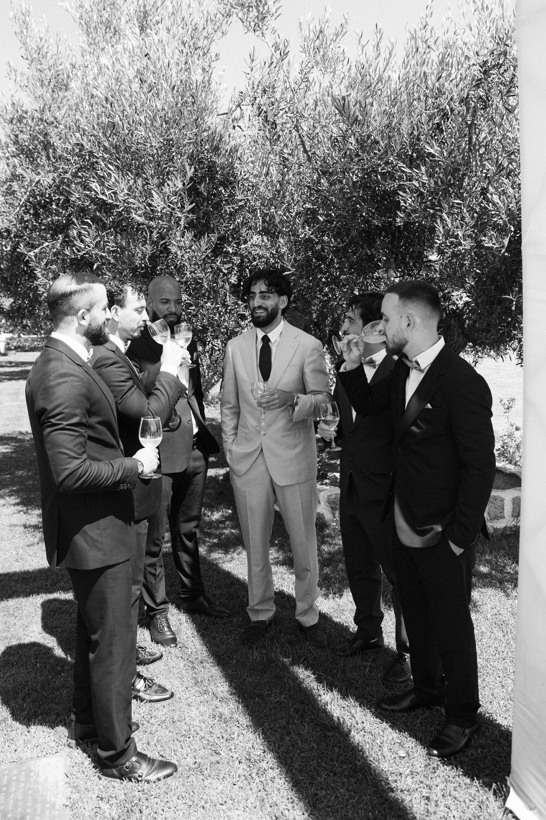 Aran and Lina embracing during their beach wedding at Pantazara Del Mare in Skioni, Halkidiki