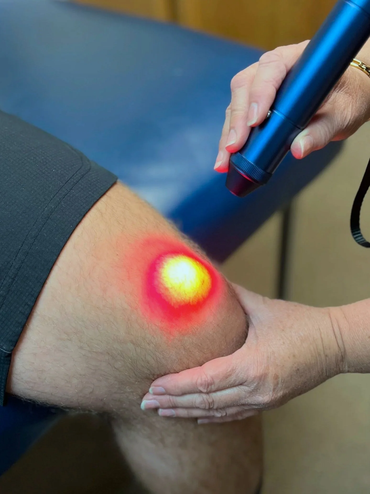 Woman smiling with a neck cooling collar on her shoulder