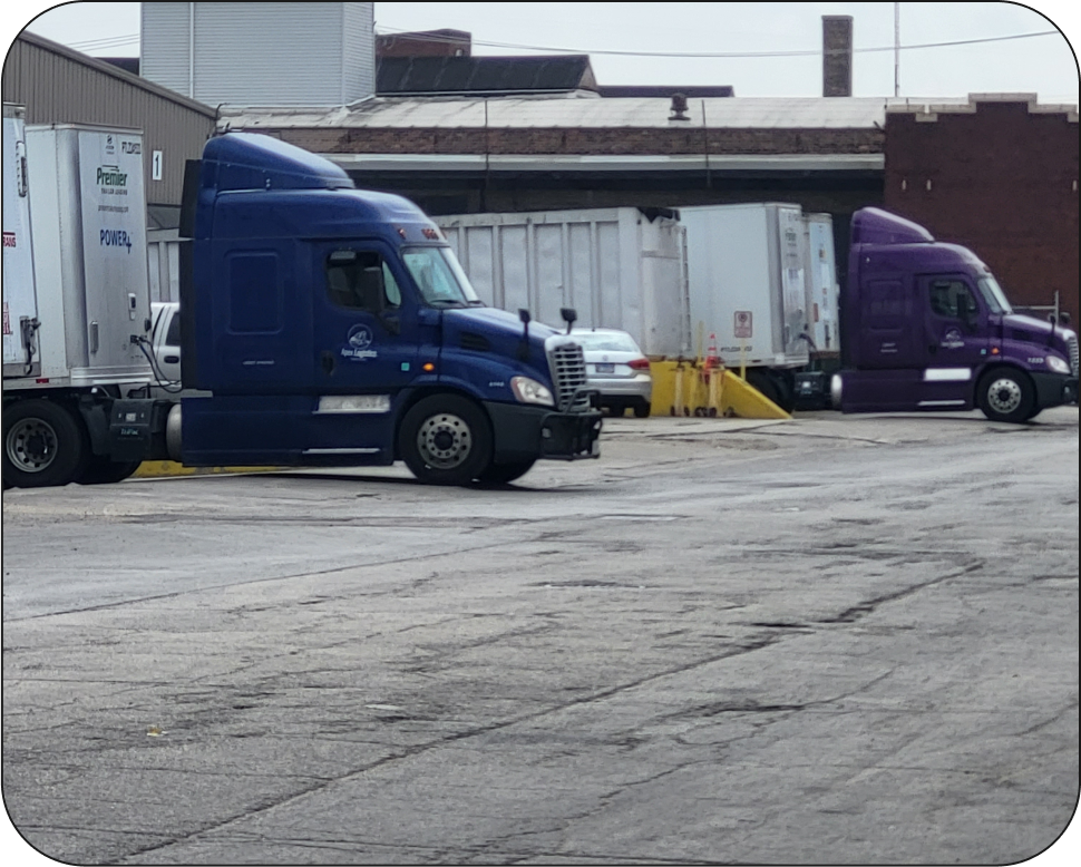 Dry van semi trucks in a Chicago shipping yard