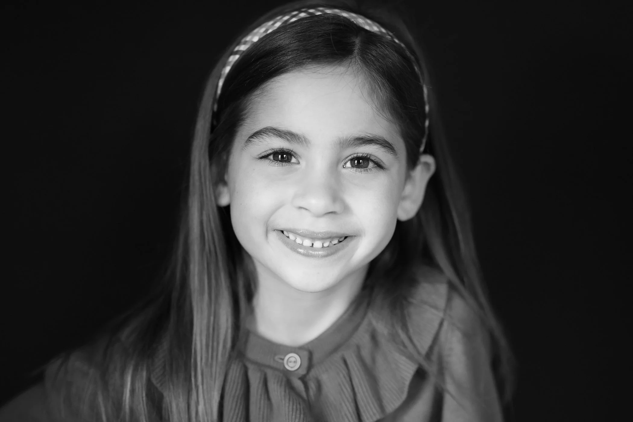 Black and white of young girl with big beautiful eyes