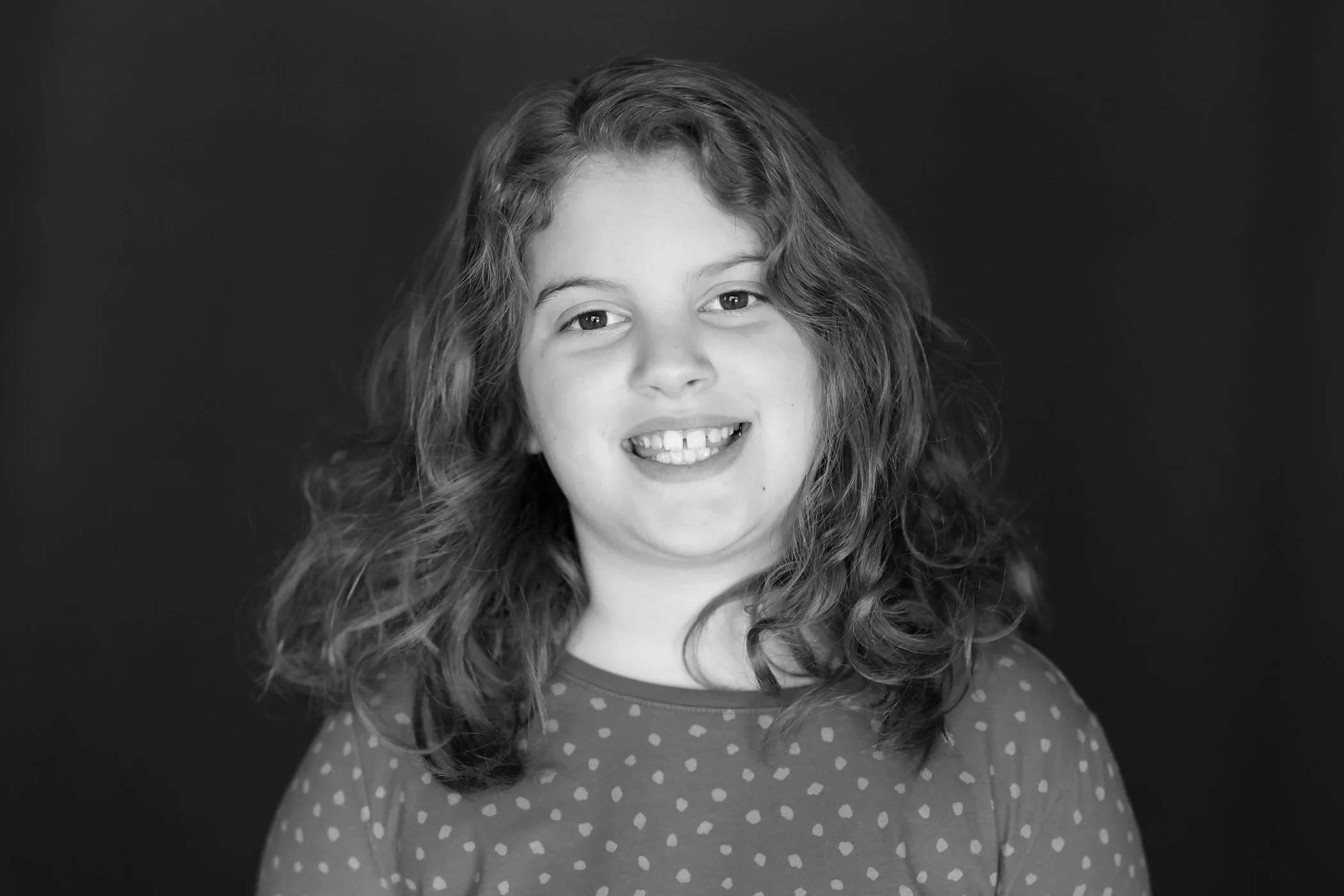 black and white of happy girl with big smile