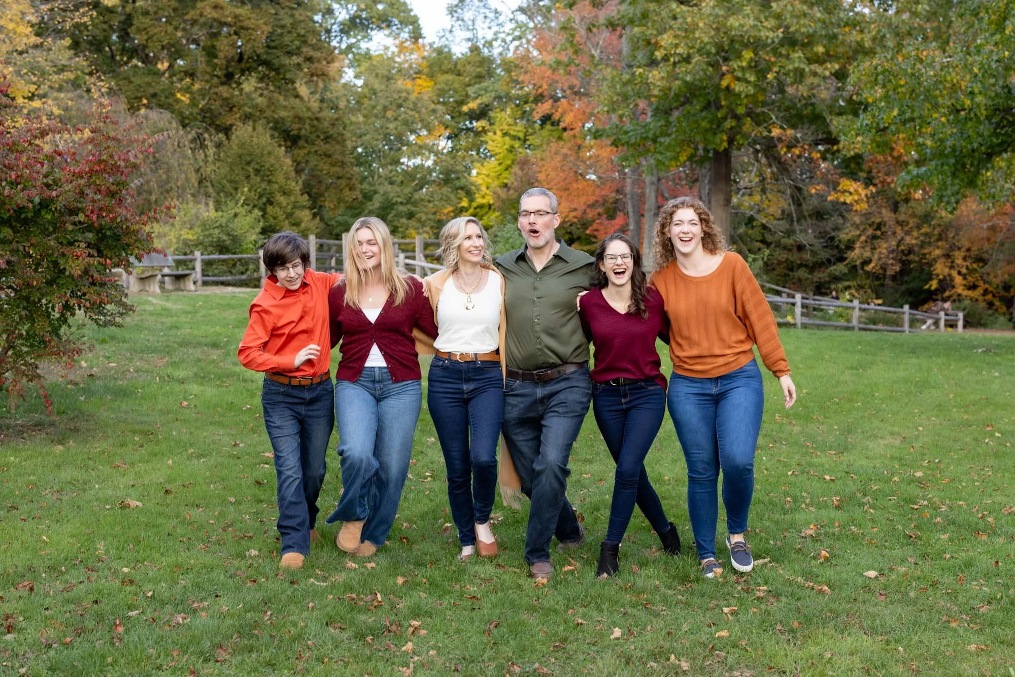 family fun showing goofy walk while laughing arm in arm.jpg