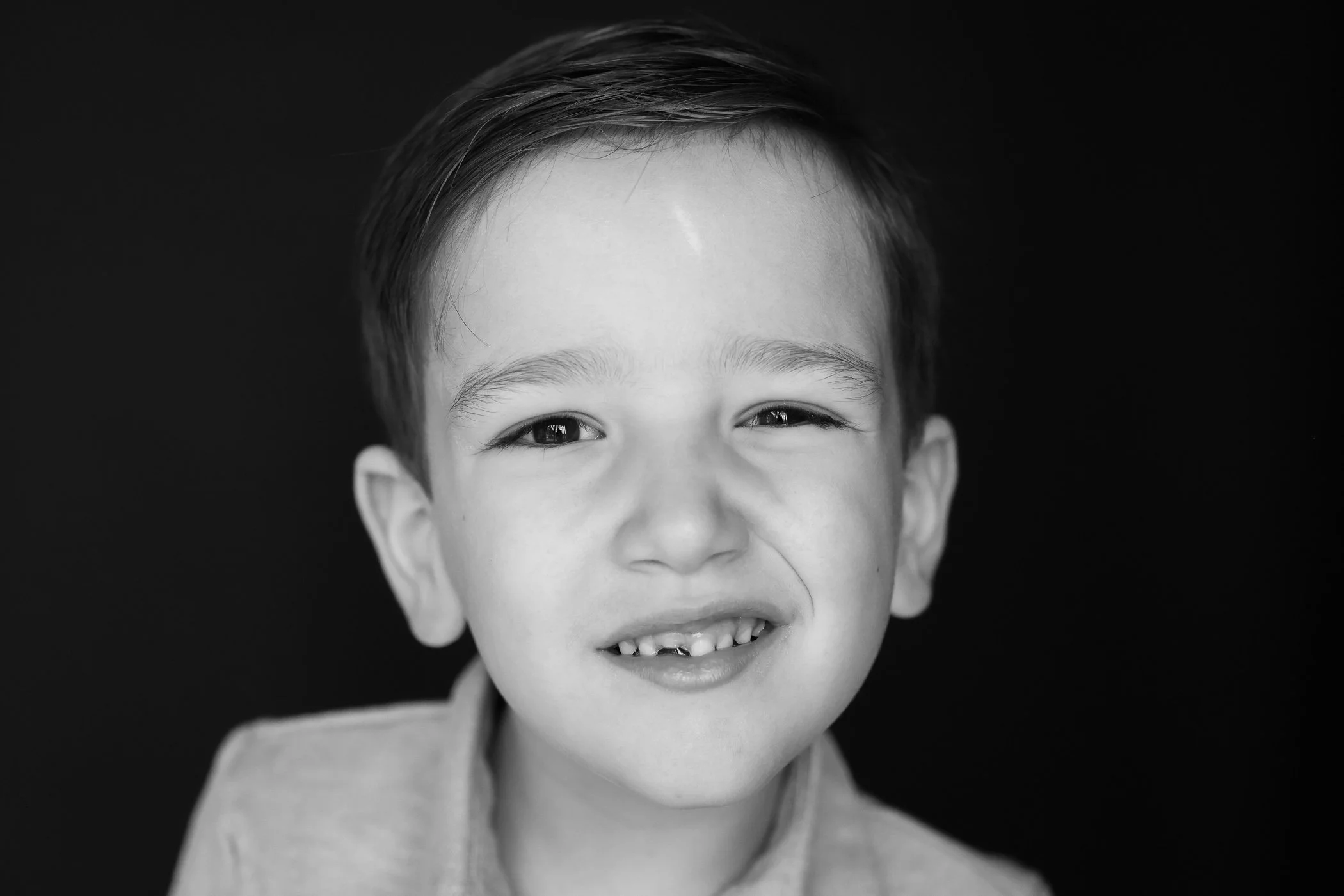 Fine Art School Photo of boy with curious expression missing front tooth