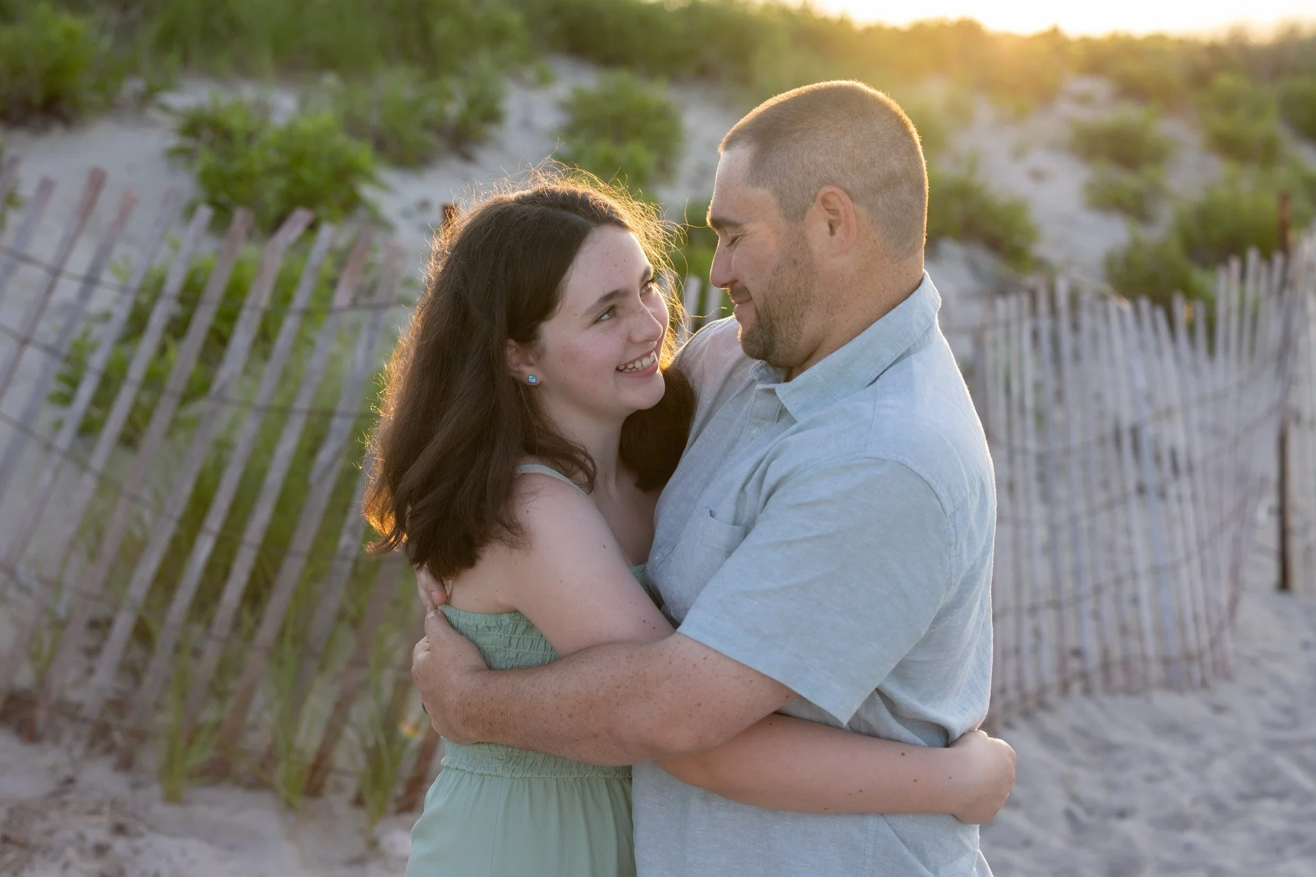 daughter-and-daddy-hug-and-smile-showing-love-and-connection.jpg
