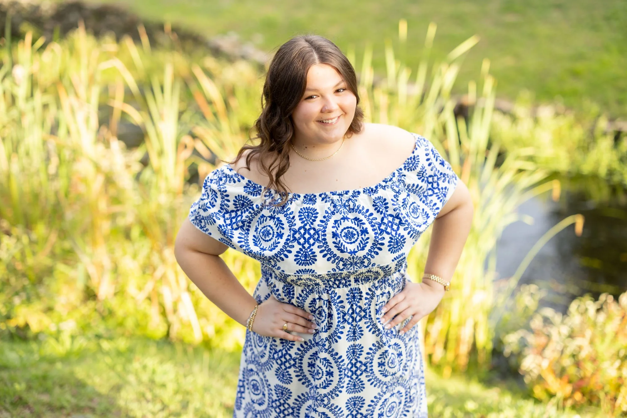 high school female smiling in blue and white dress.jpg