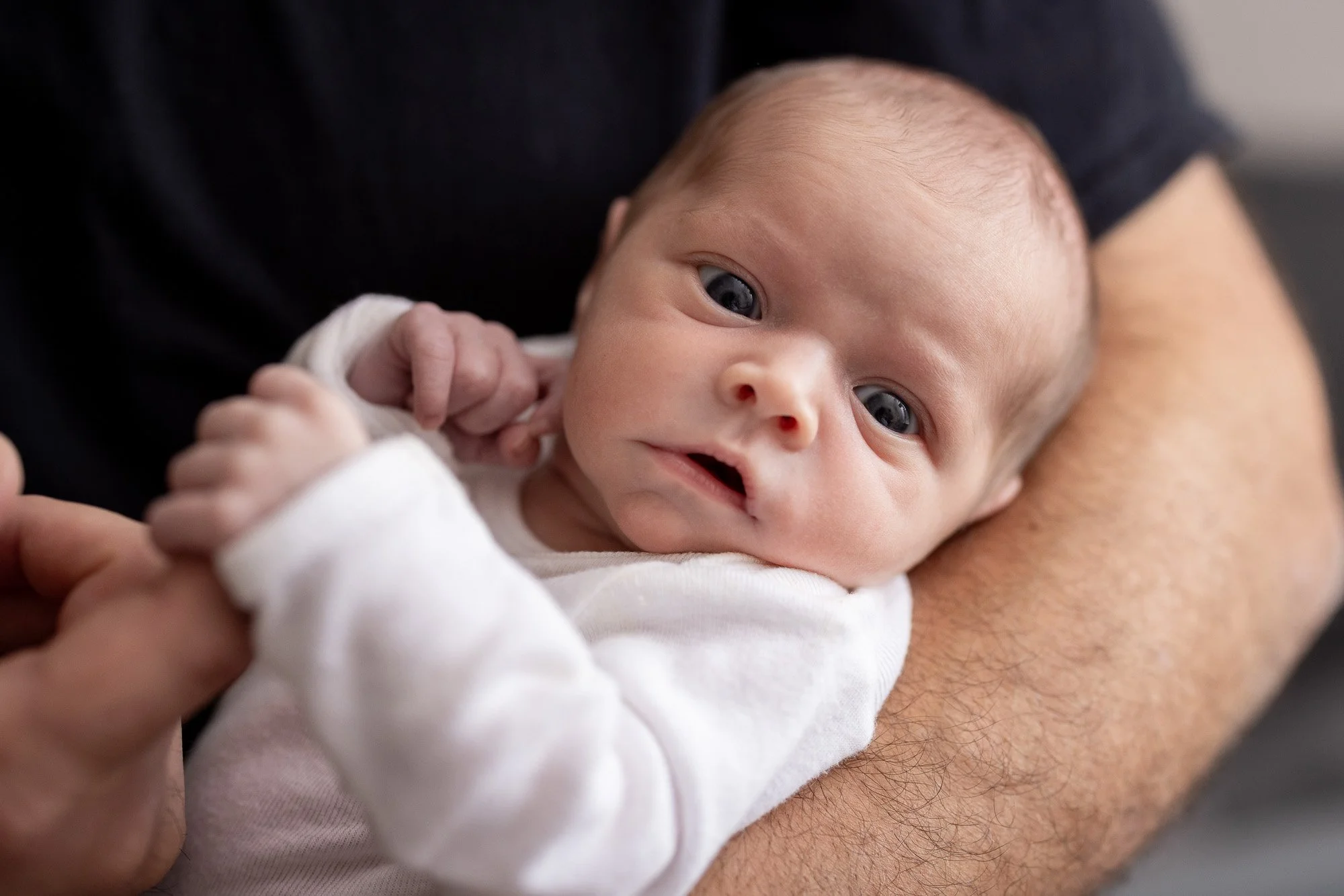 dad cradling baby girl.jpg