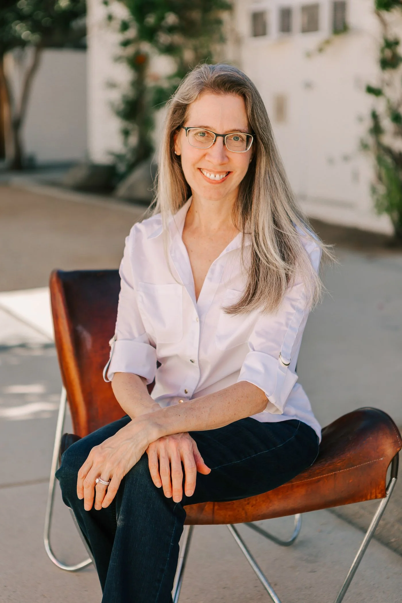 Portrait of Jennifer Banks sitting in chair