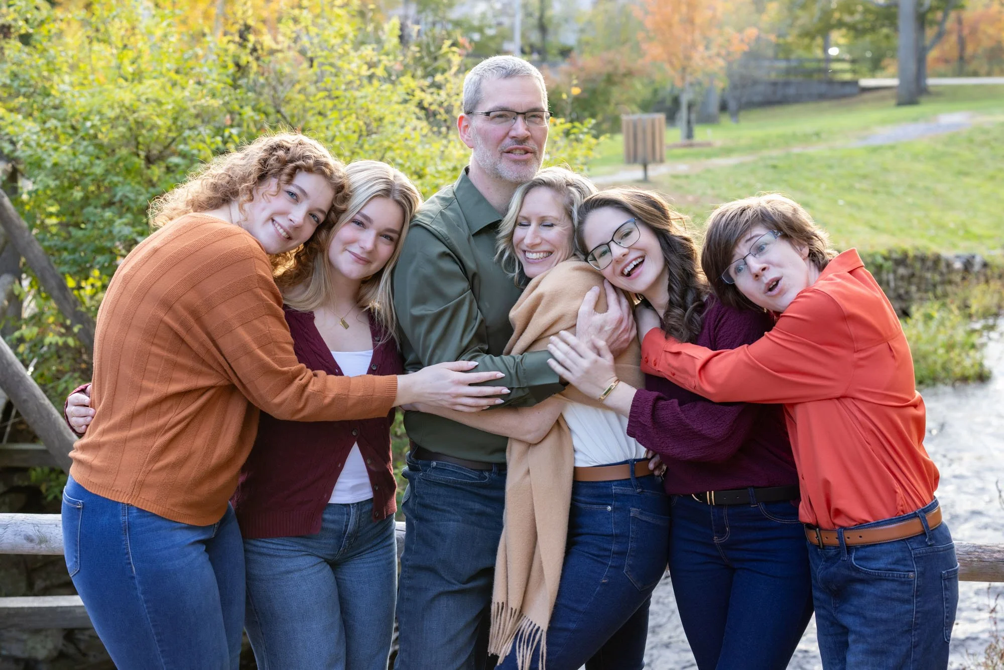 blended family of 6 standing and hugging in park.jpg