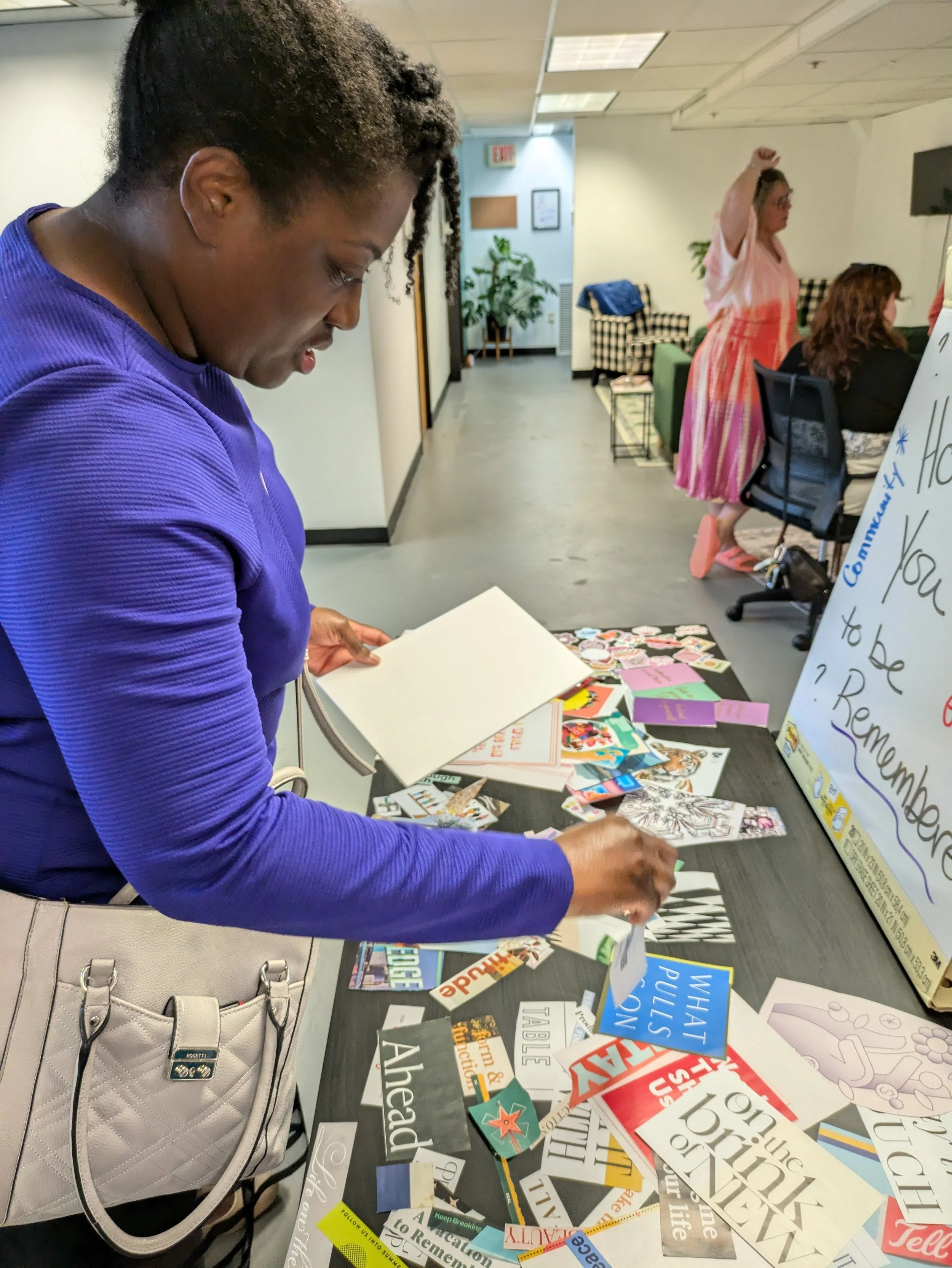 Board Member Patrice Taffe getting her vision board clippings  - Windsor Women's Networking at Windsor Worx