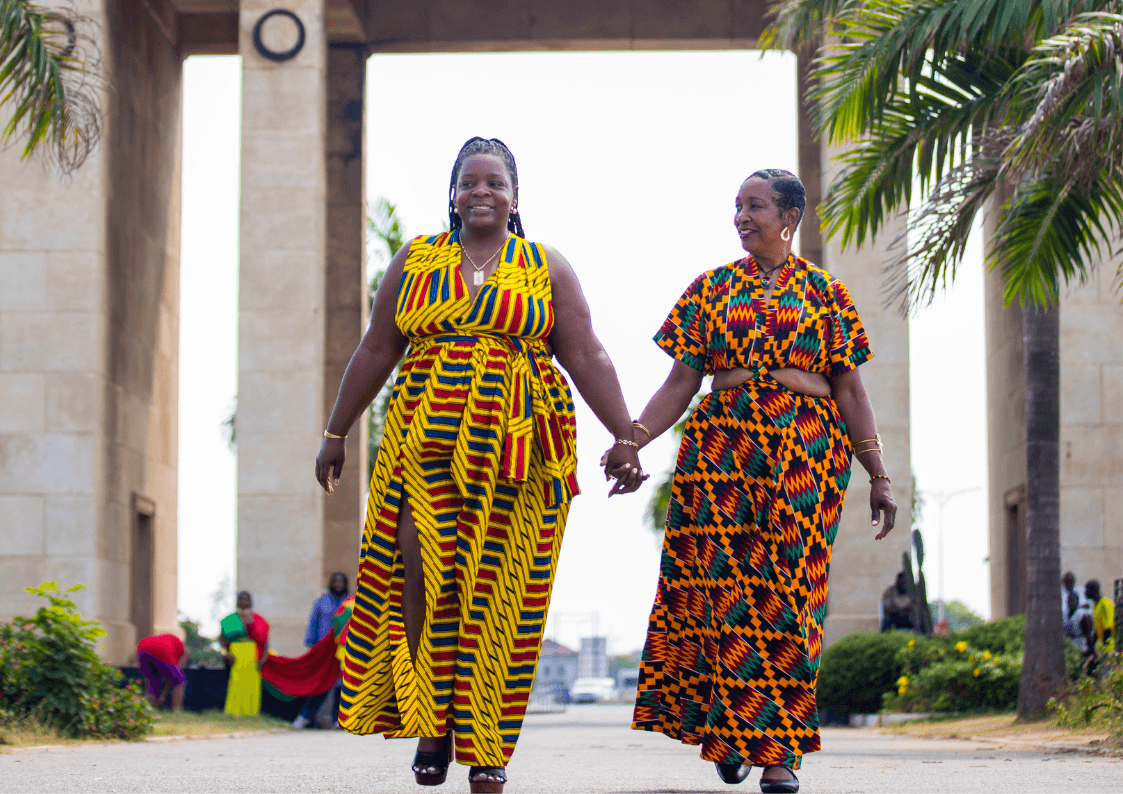 Two women at the Black star square wearing Ghana traditional clothing