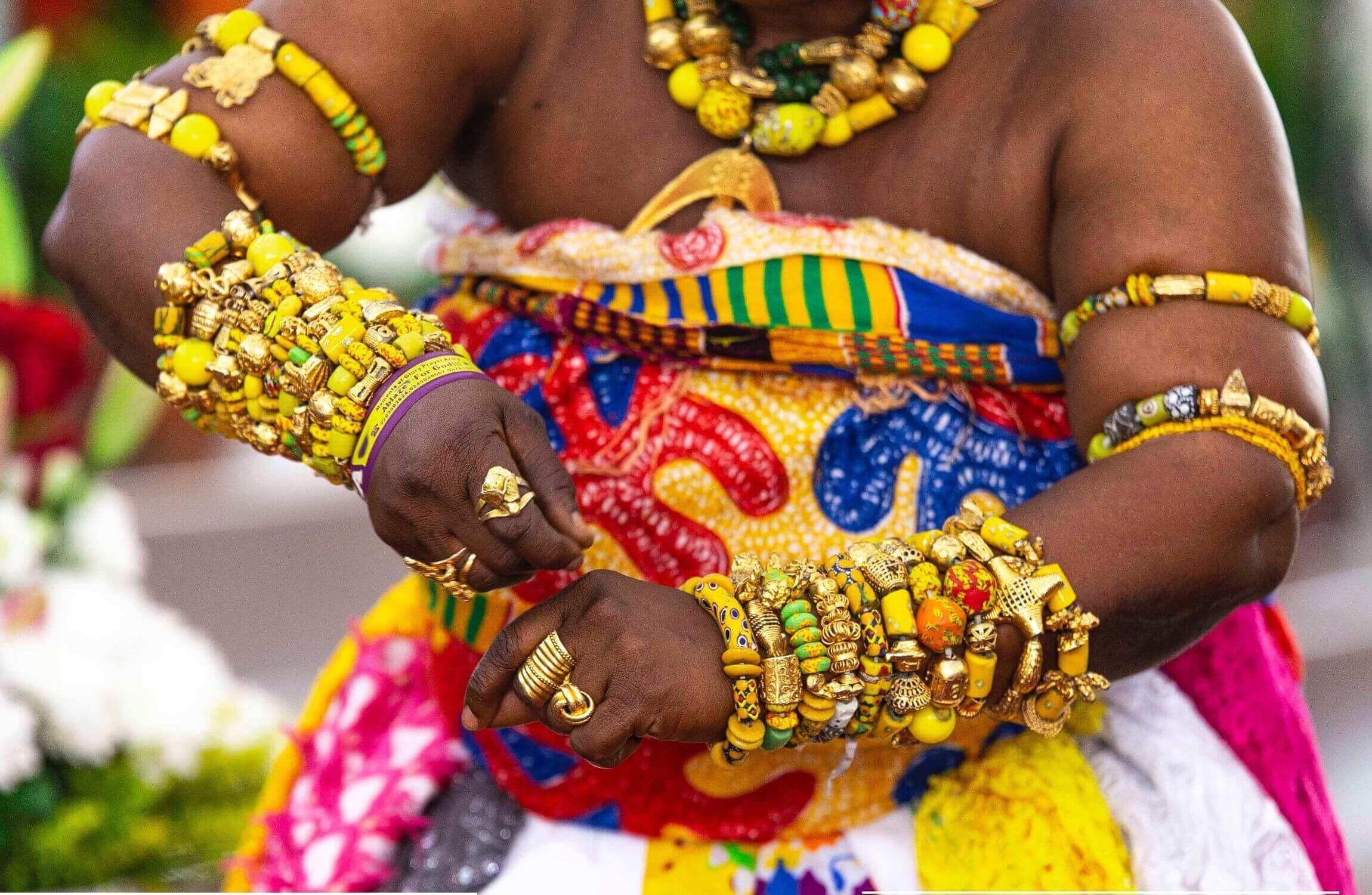 An Ashanti Woman dressed in Ashanti traditional attire dancing Adowa, a traditional Ashanti dance.