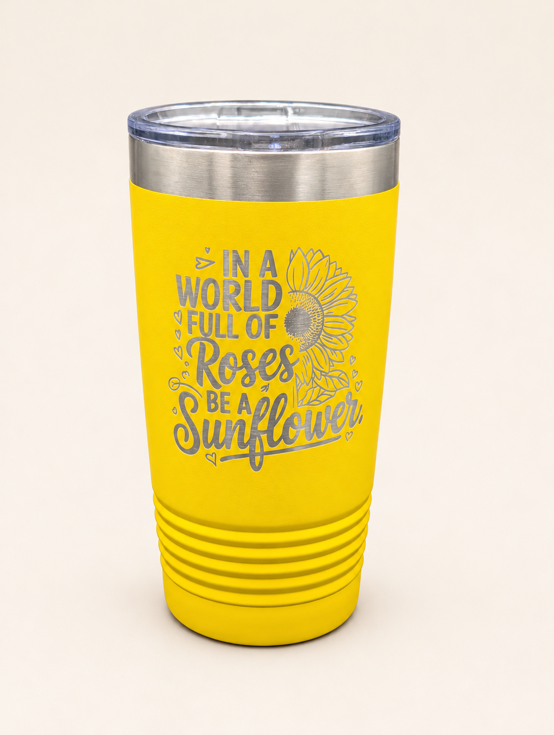 Sunflower tumbler on warm ivory backdrop.png