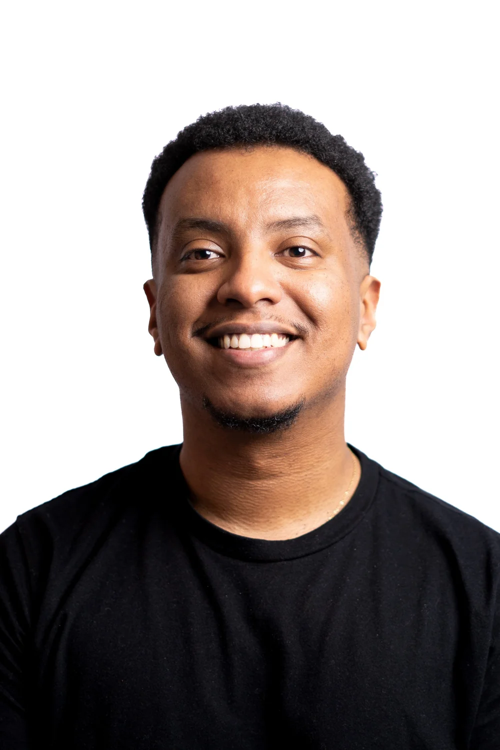 Nathanael, the photographer behind Life Photos, smiling