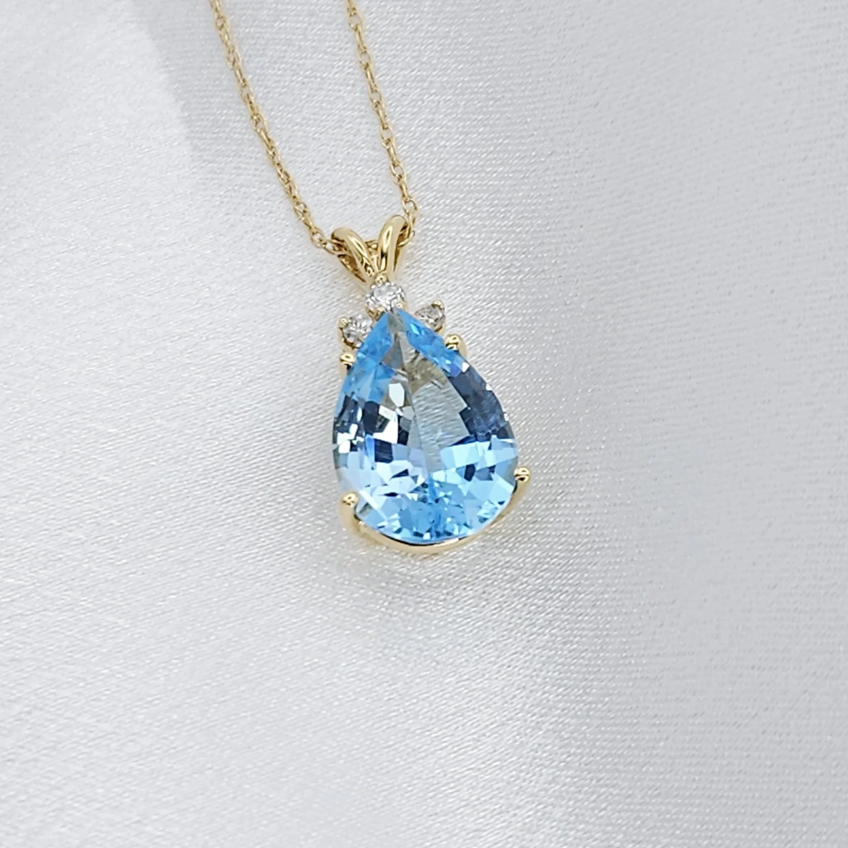 Pear Cut Blue Topaz And Diamond Pendant (8.50 CT)