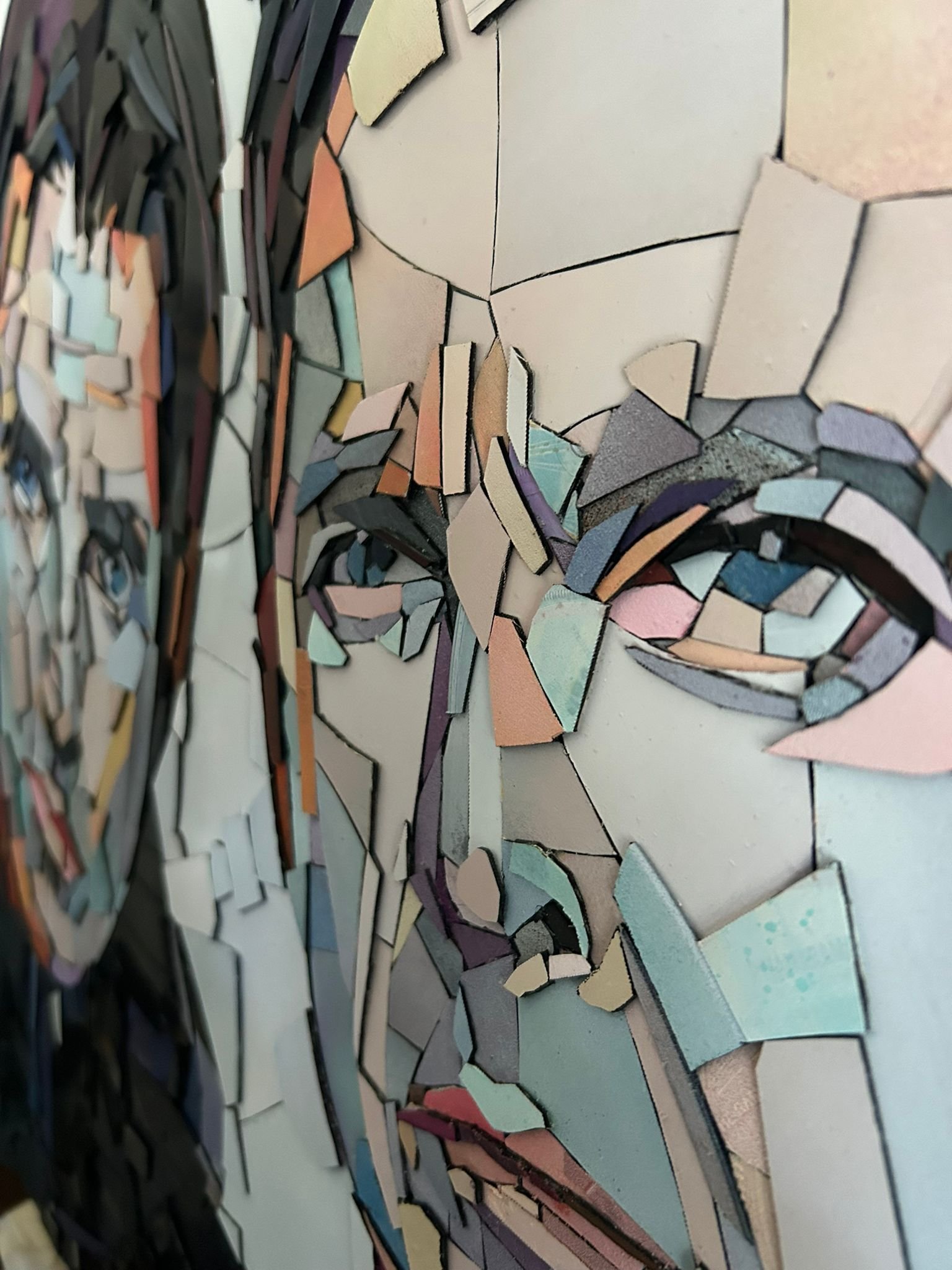 Ed Chapman, The Gallagher Brothers. Made from Hundreds of pieces of. vinyl records. . Individually applied. To produce a portrait of Liam Gallagher and Noel Gallagher. With bright, vibrant colours.