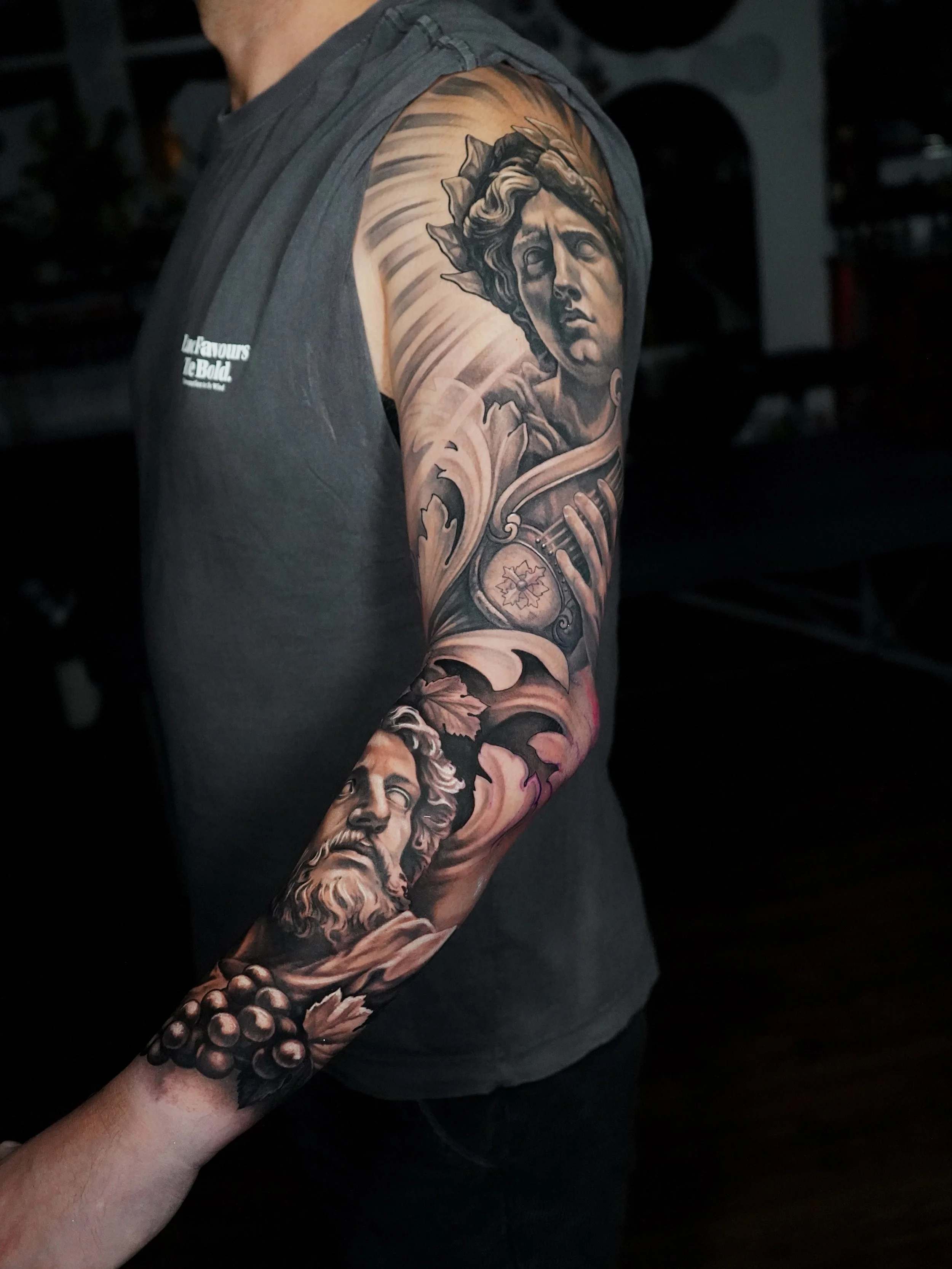 Greek mythology sleeve 🏛️🏺
Apollo and Dionysus with filigree and grapes. Having a blast on this.

Booking Brisbane from July onwards, get in touch with your ideas!

Done with @lotusneedles 
@australiantattooistsguild 

#greekmythology #brisbanetatt