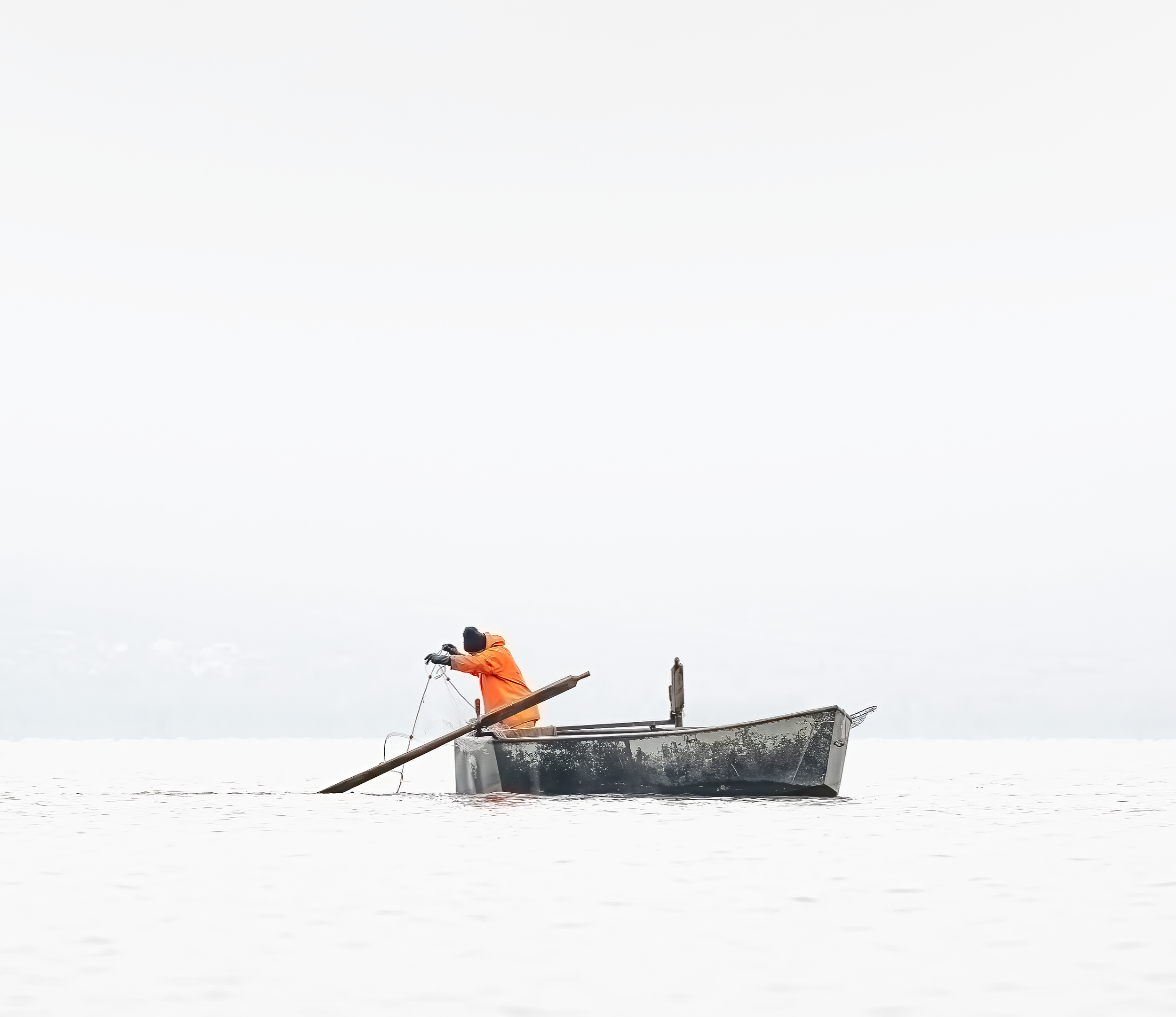 Fisherman in small boat on Lake Kerkini in Greece