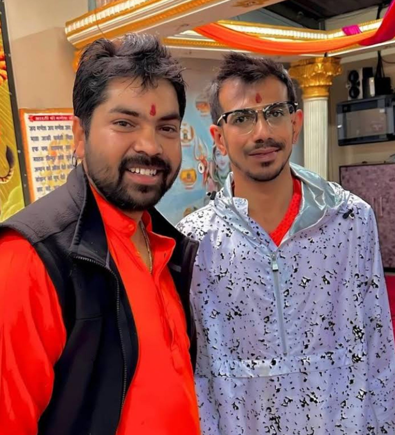 Hindu Priest Acharya Raj pictured with Indian cricketer Yuzvendra Chahal after performing a pooja.