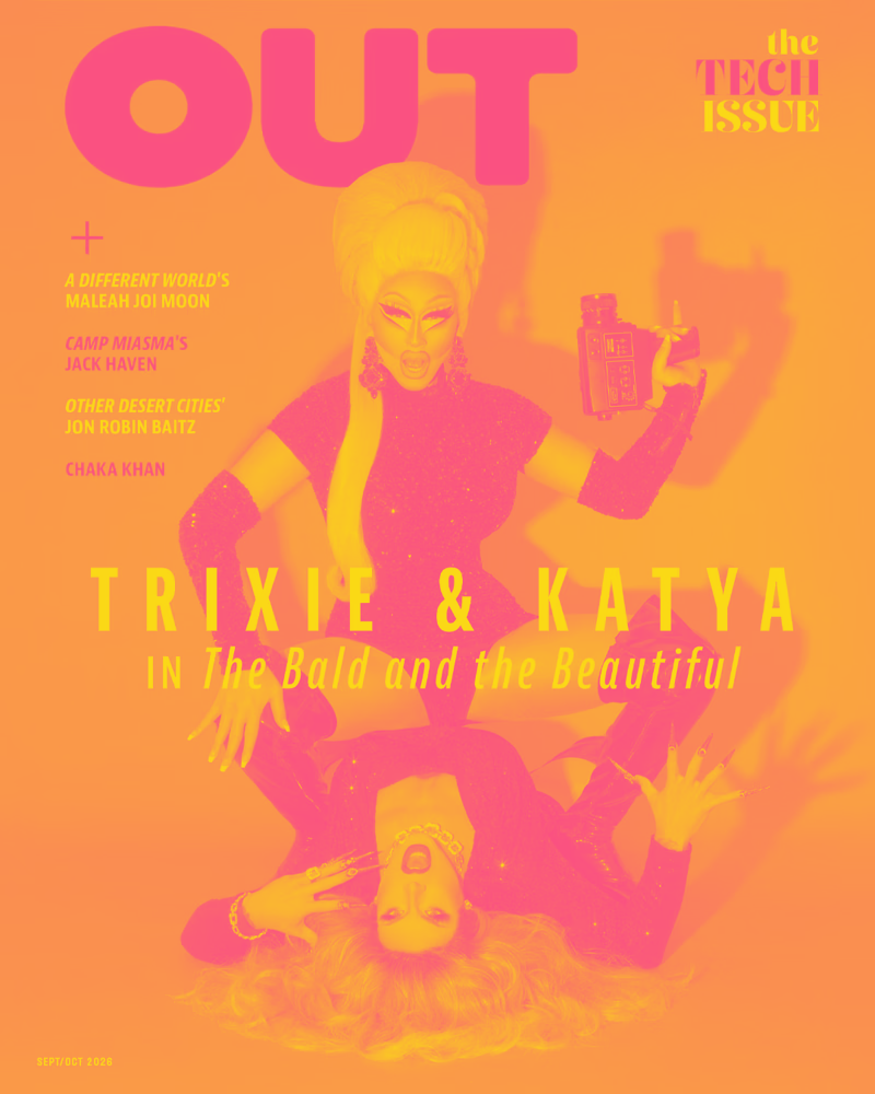 Cover of OUT magazine featuring Trixie and Katya for the September/October 2024 issue, with vibrant pink and yellow colors, showing two drag queens, one with platinum blonde hair holding a vintage camera, and the other with voluminous curly hair lyin