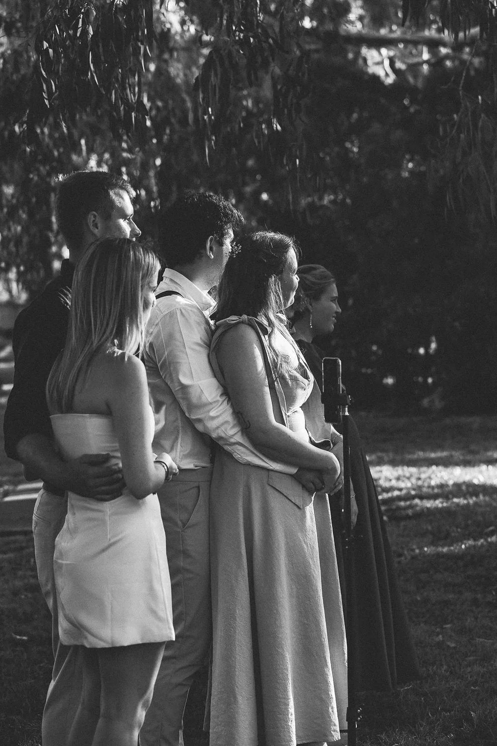 Guests looking on at couple being married