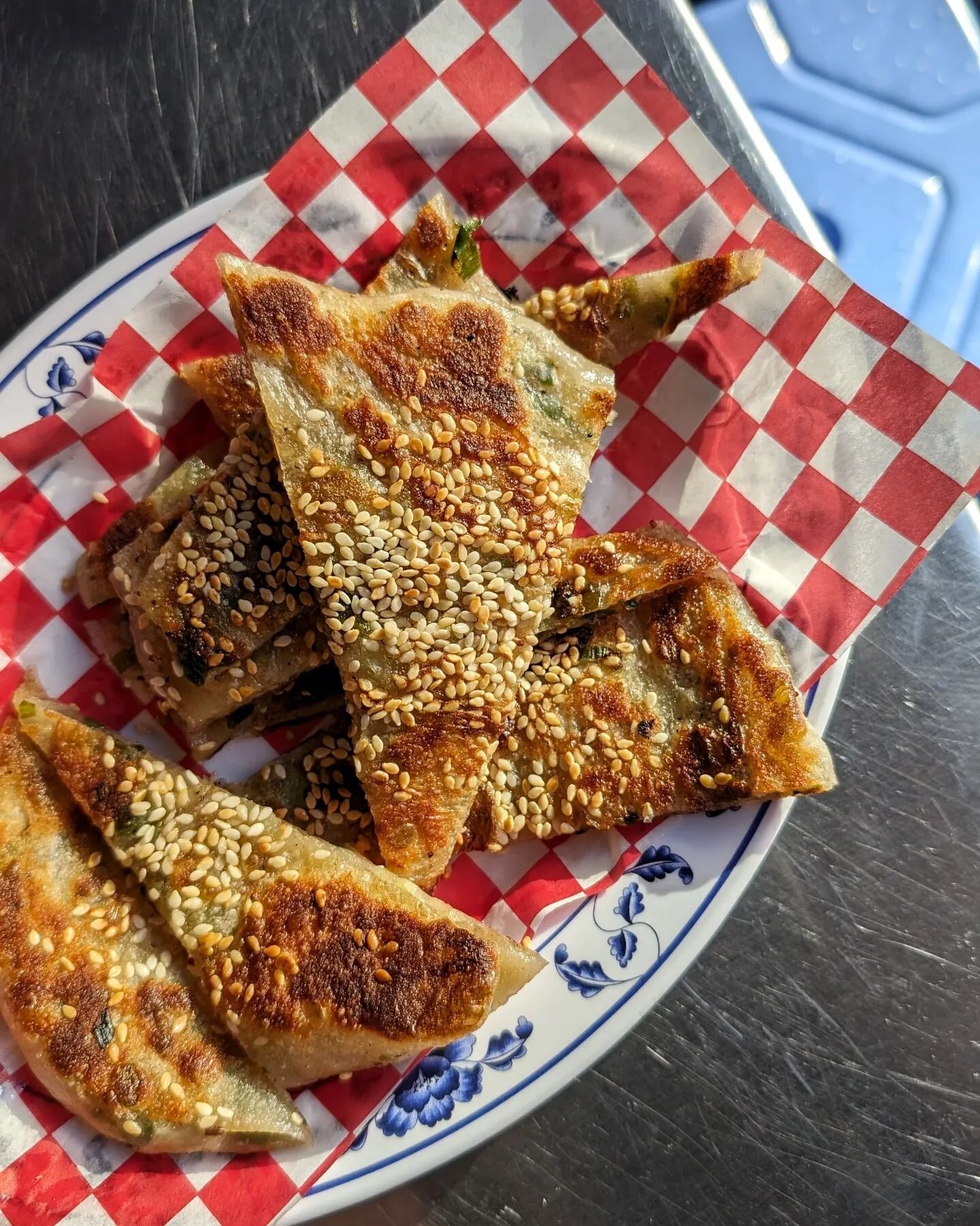 Years later, still on the scally p grind. We've adjusted the recipe (again), adding a more precise amount of salted hot water so the pancakes can stay moist and tender for longer. The toasted sesame + lard resembles top notch shaobing, our mystery pe